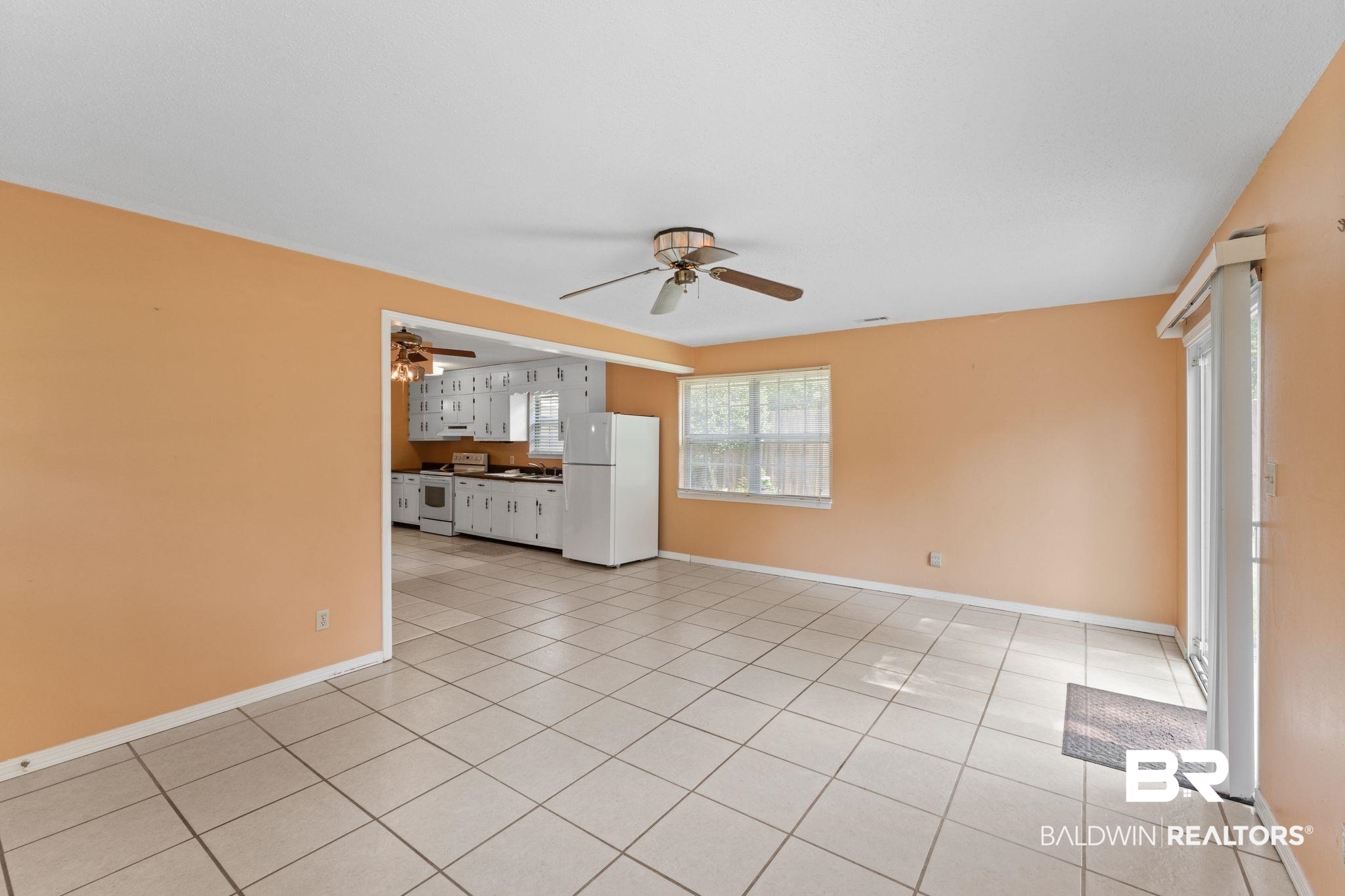 14095 Riverside Drive Foley, AL 36535 - Photo 7 of 30 Unfurnished living room featuring a ceiling fan and light tile patterned floors