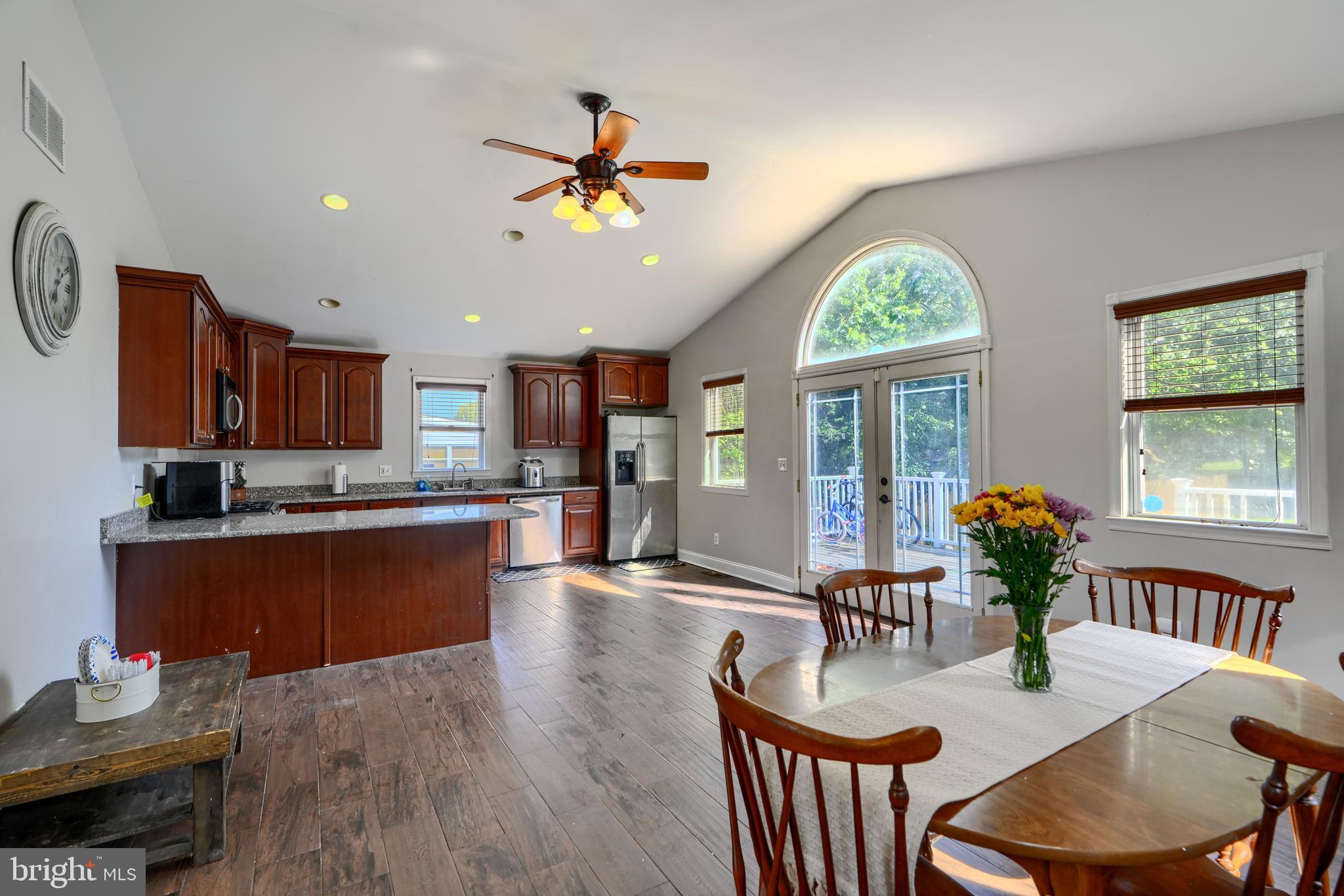 5221 Trumps Mill Road Baltimore, MD 21206 - Photo 1 of 53 a living room with kitchen island furniture and a chandelier
