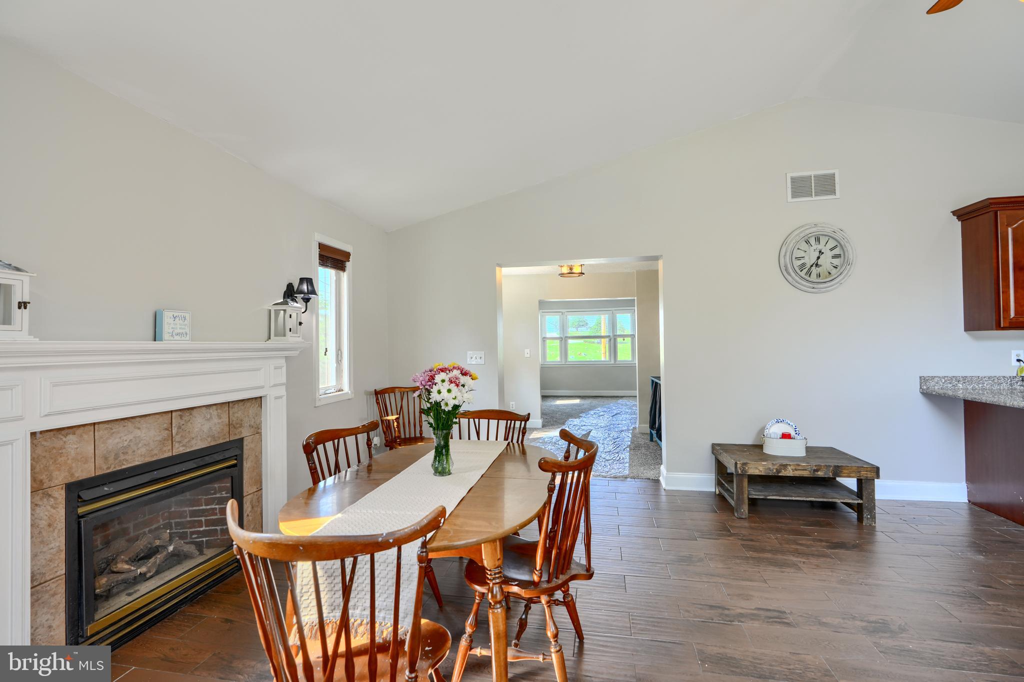 5221 Trumps Mill Road Baltimore, MD 21206 - Photo 13 of 53 a living room with furniture a fireplace and a window