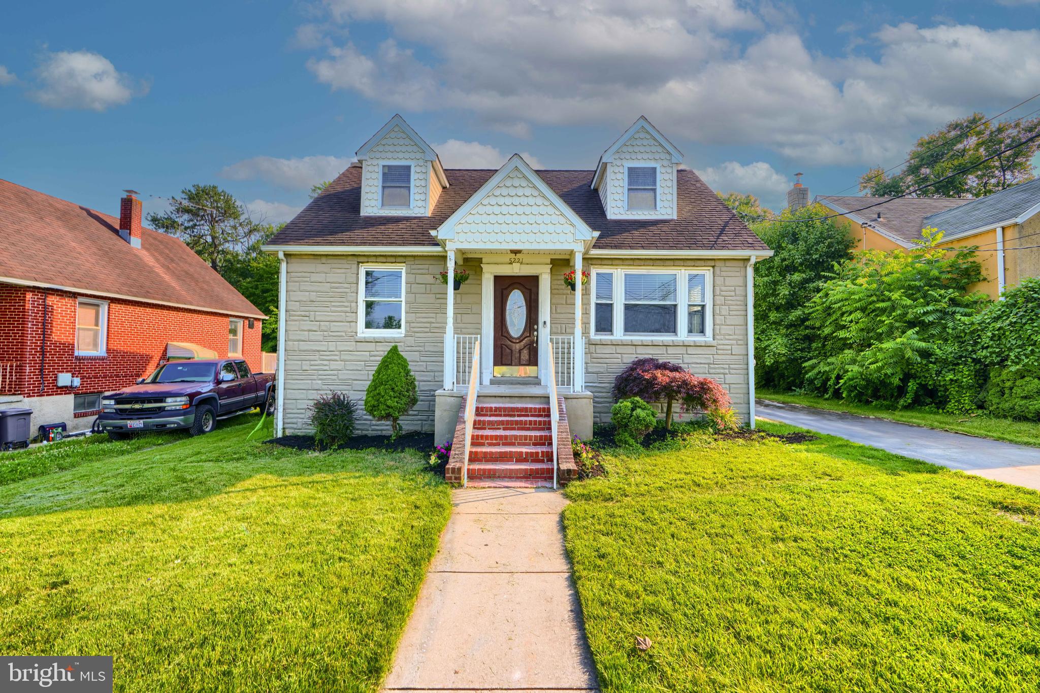 5221 Trumps Mill Road Baltimore, MD 21206 - Photo 2 of 53 a front view of a house with garden