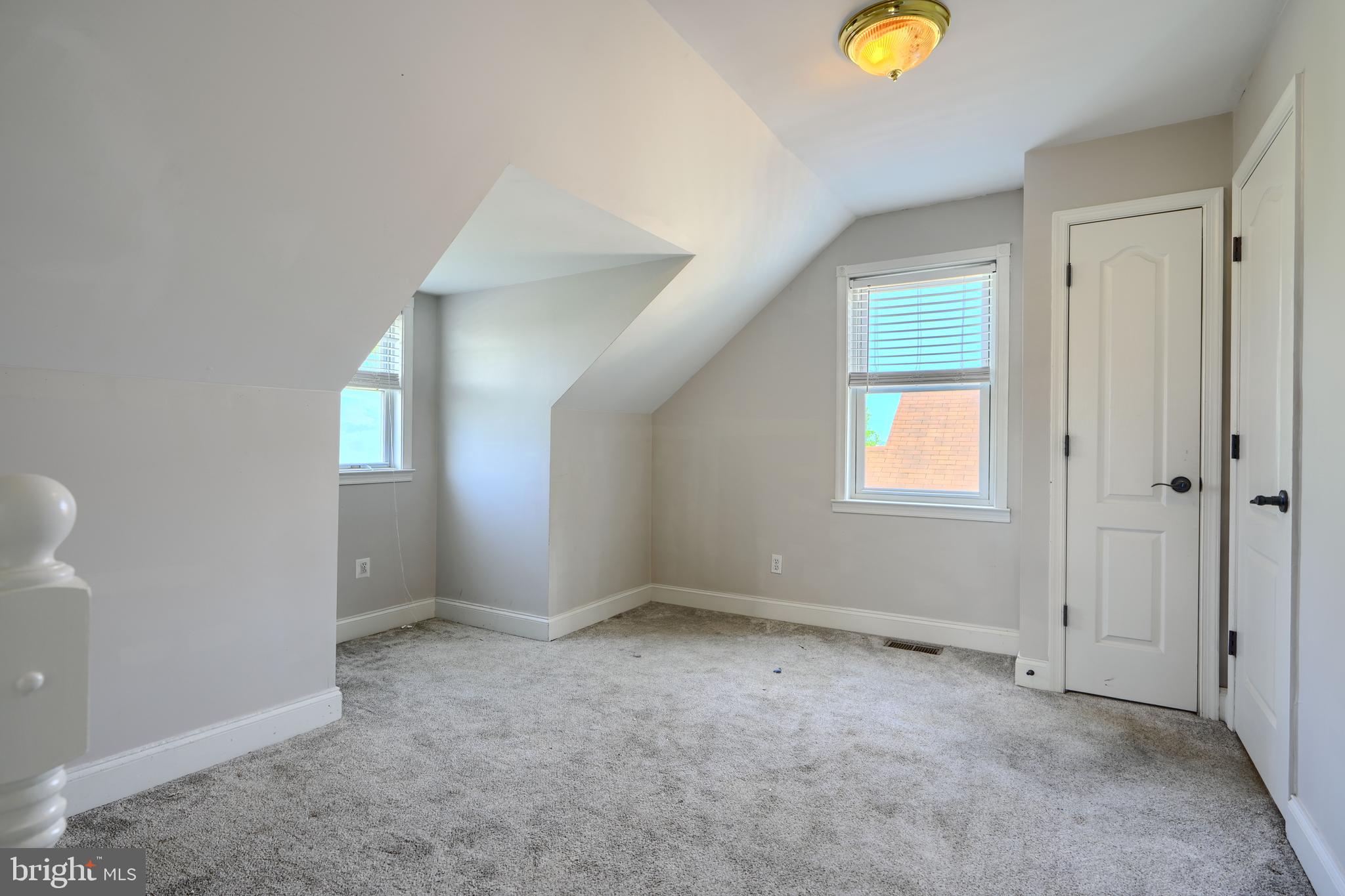 5221 Trumps Mill Road Baltimore, MD 21206 - Photo 26 of 53 a view of an empty room with a window