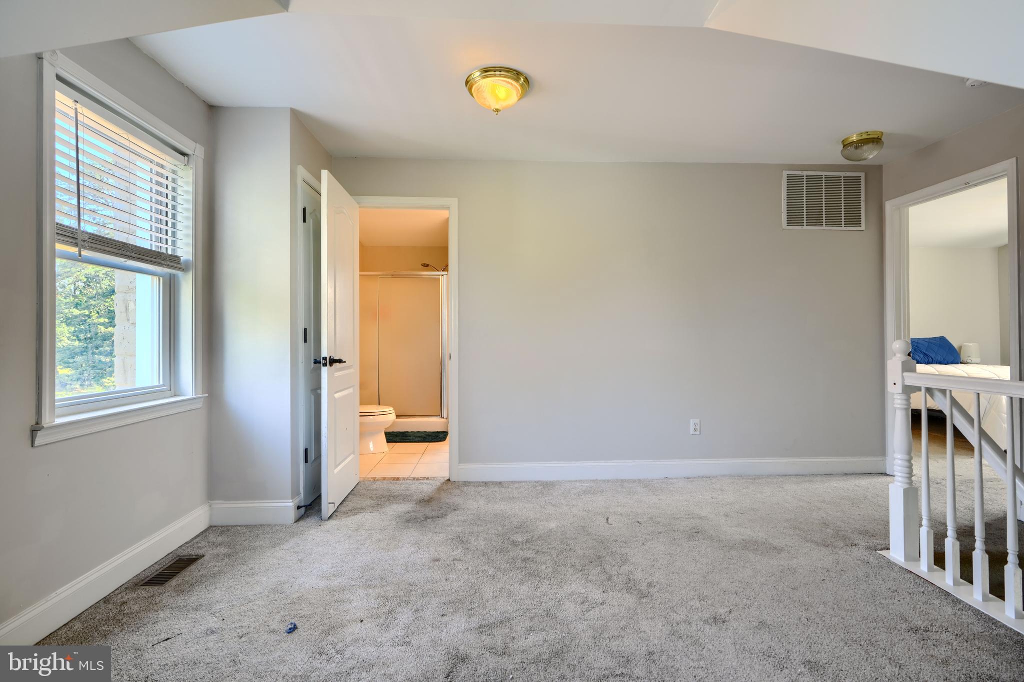 5221 Trumps Mill Road Baltimore, MD 21206 - Photo 27 of 53 a view of empty room with windows and entryway