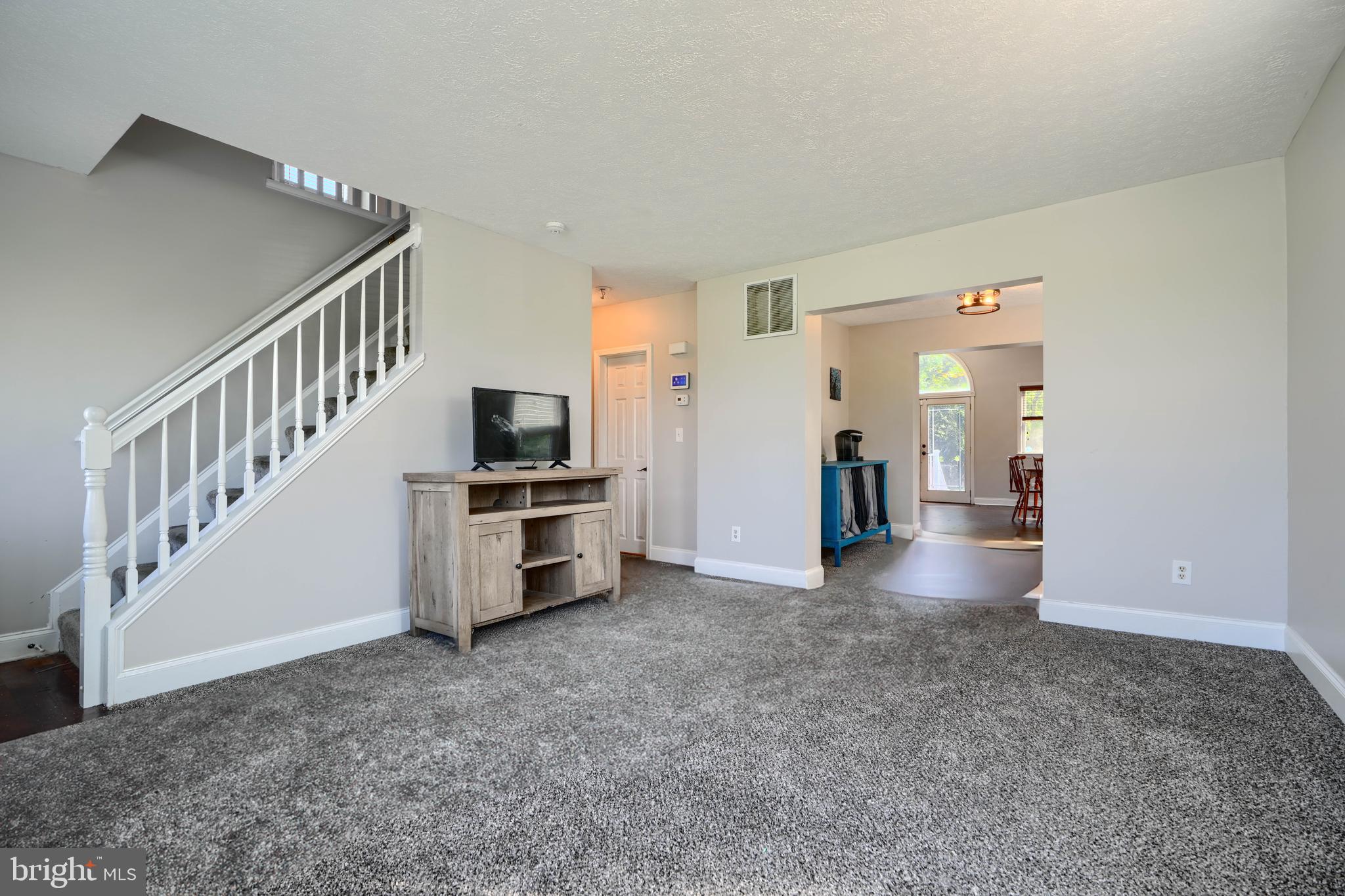 5221 Trumps Mill Road Baltimore, MD 21206 - Photo 4 of 53 a view of a living room with stairs
