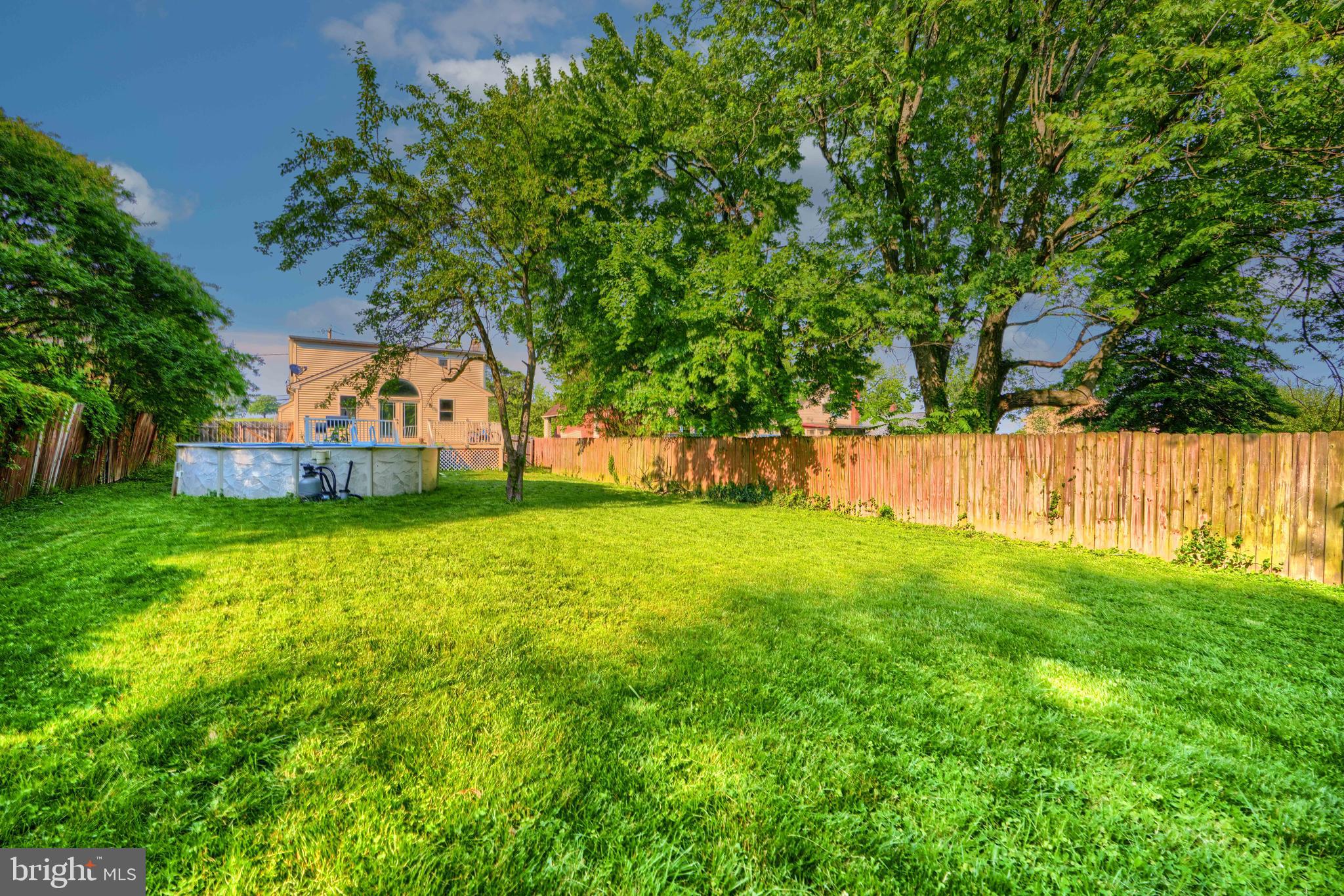 5221 Trumps Mill Road Baltimore, MD 21206 - Photo 49 of 53 a view of a house with a yard