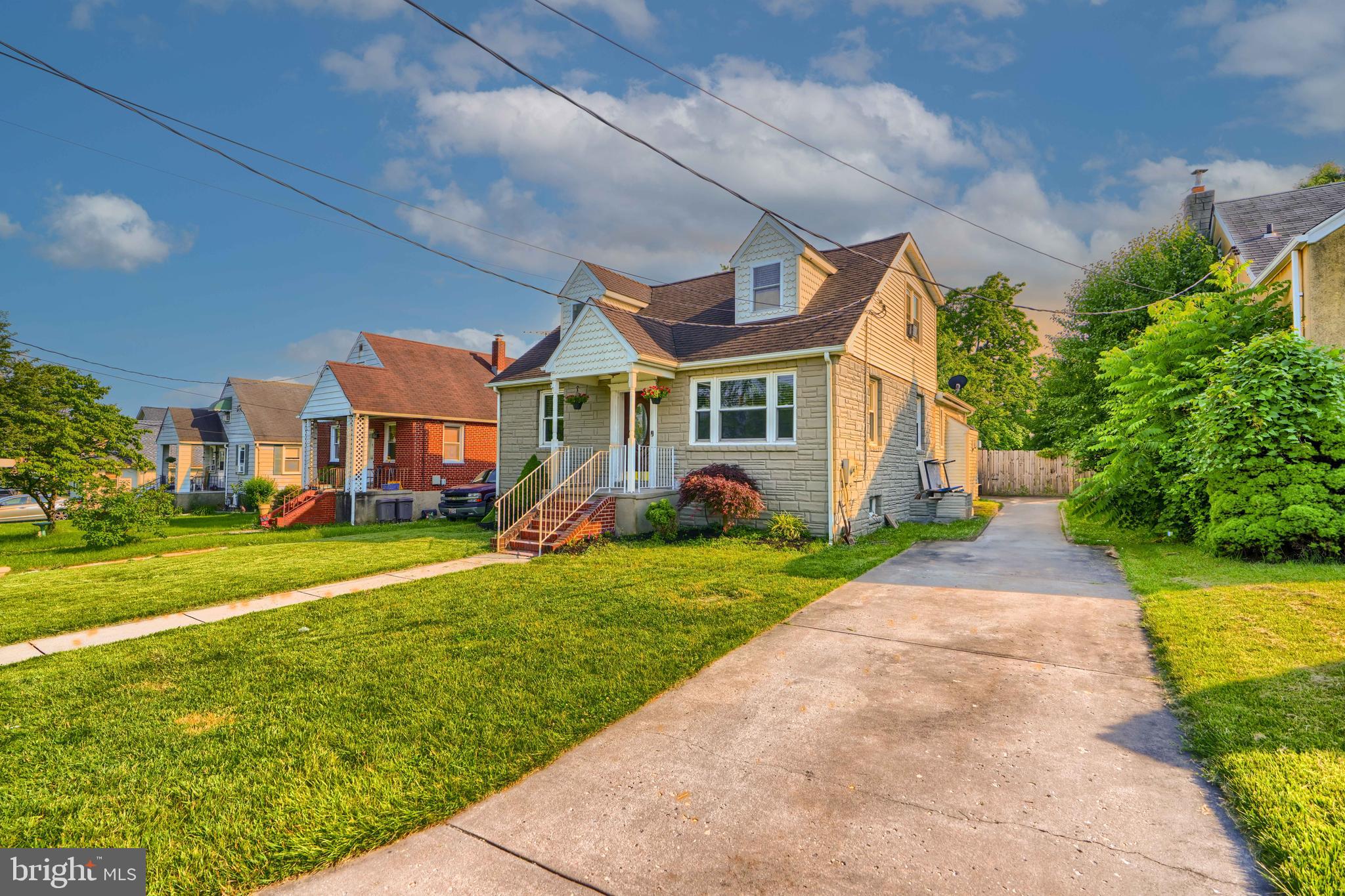 5221 Trumps Mill Road Baltimore, MD 21206 - Photo 50 of 53 a front view of a house with a yard and potted plants