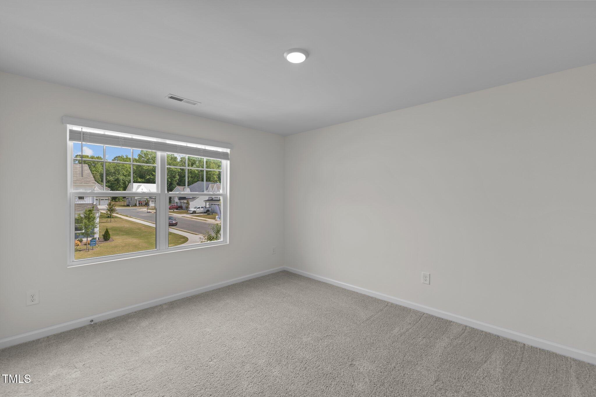 851 Embraer Way Spring Spring Hope, NC 27882 - Photo 12 of 25 an empty room with windows