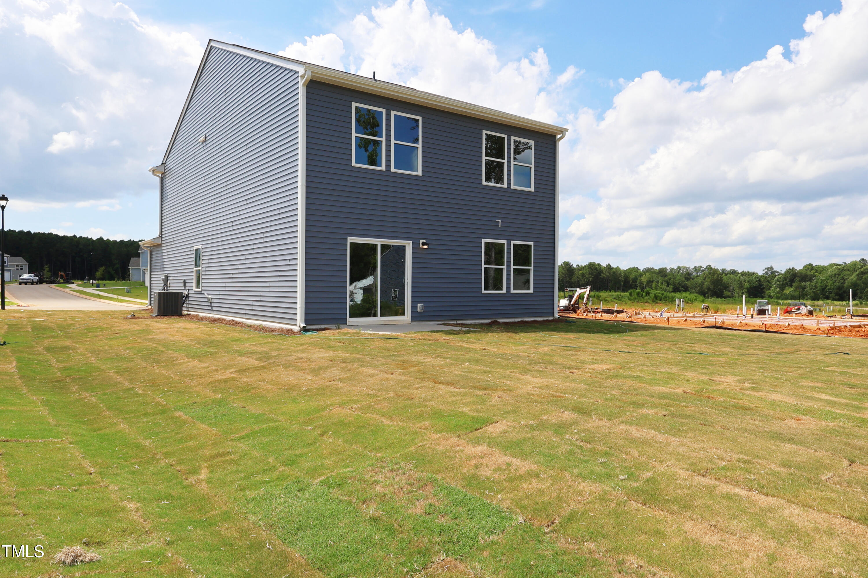 851 Embraer Way Spring Spring Hope, NC 27882 - Photo 4 of 25 a front view of a house with a yard