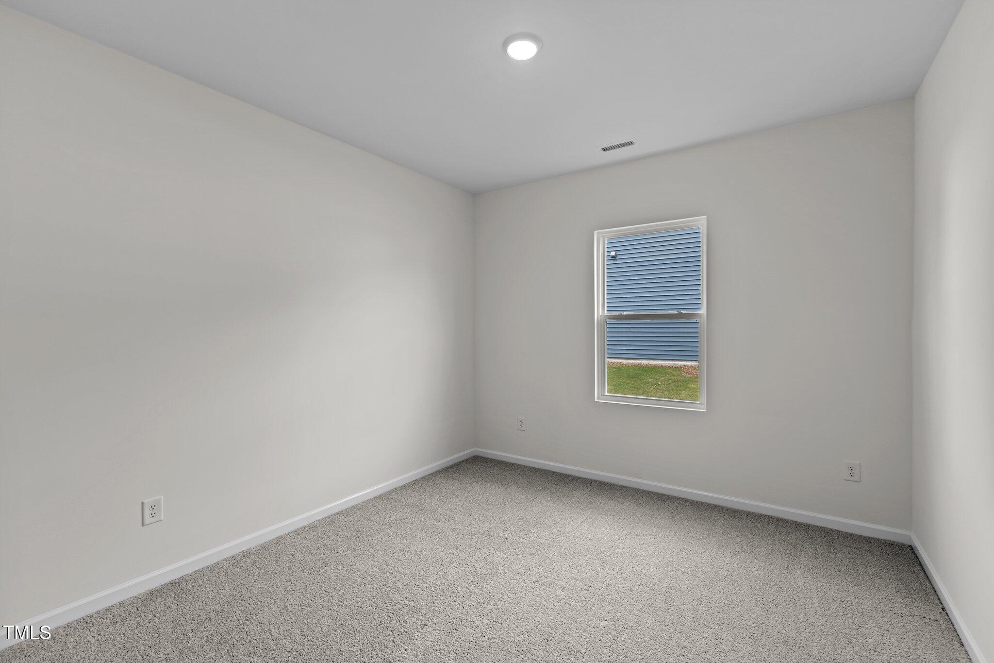 851 Embraer Way Spring Spring Hope, NC 27882 - Photo 8 of 25 a view of an empty room with a window