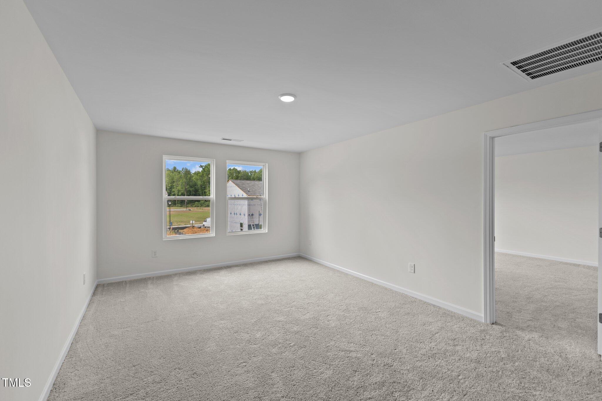 851 Embraer Way Spring Spring Hope, NC 27882 - Photo 9 of 25 an empty room with windows