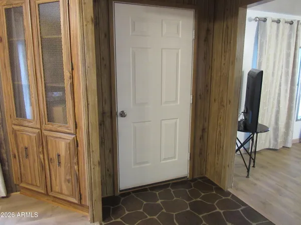 a kitchen with a refrigerator and cabinets