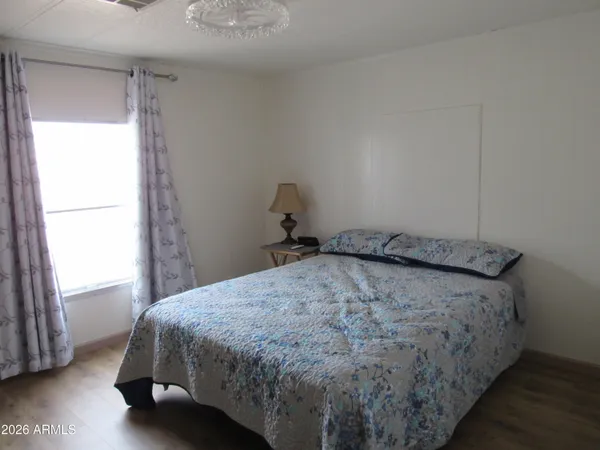 a view of a backyard house and swimming pool