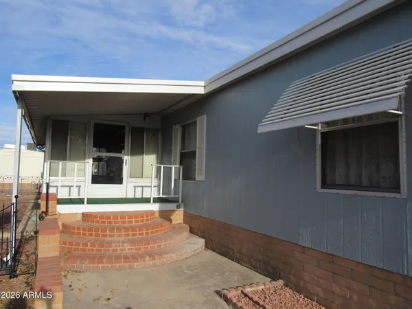 a kitchen with granite countertop stainless steel appliances a refrigerator sink and microwave