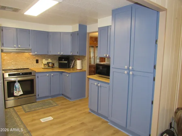 a bathroom with a granite countertop sink and shower