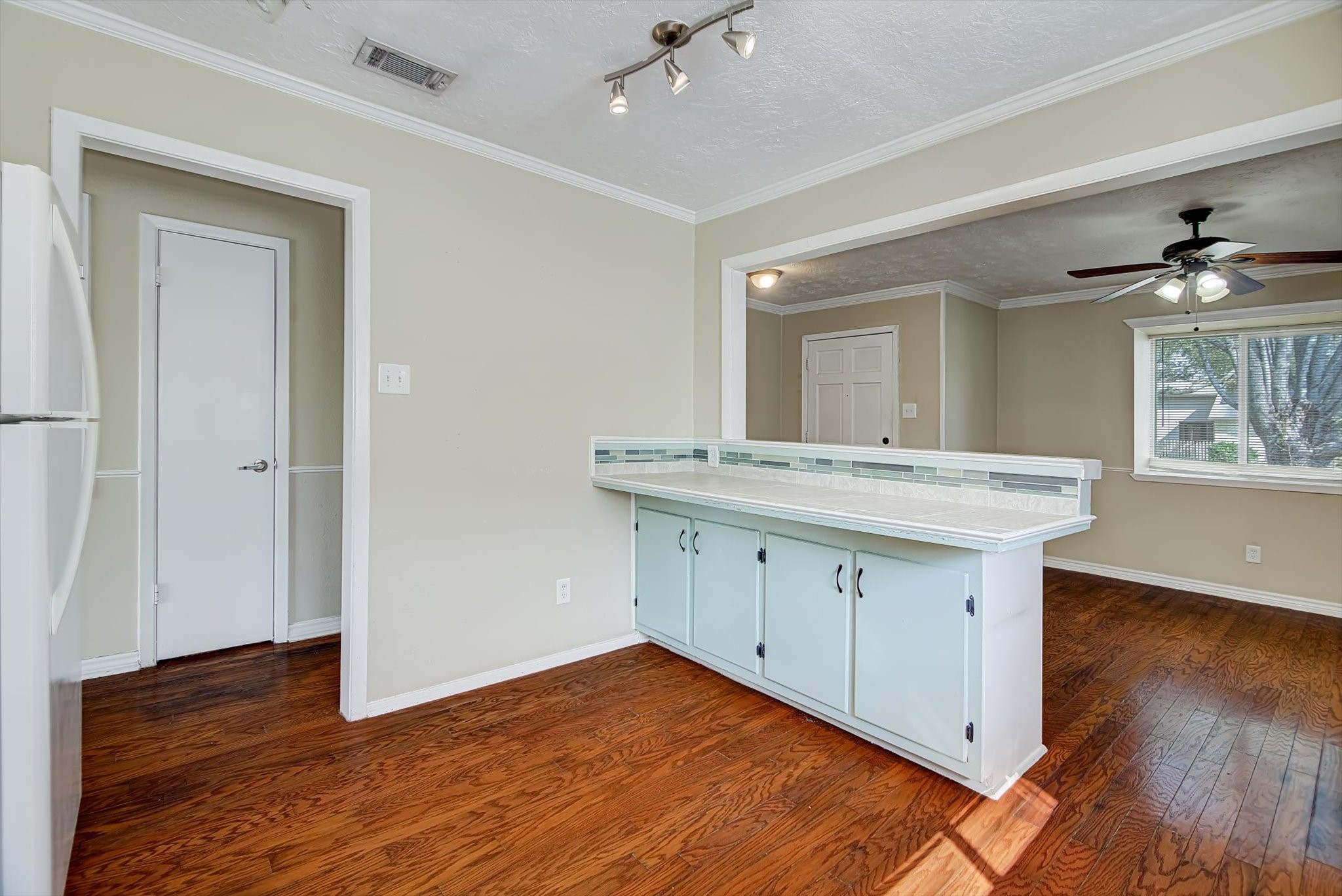 7515 Shoshone Drive Baytown, TX 77521 - Photo 12 of 39 a kitchen with a sink cabinets and wooden floor