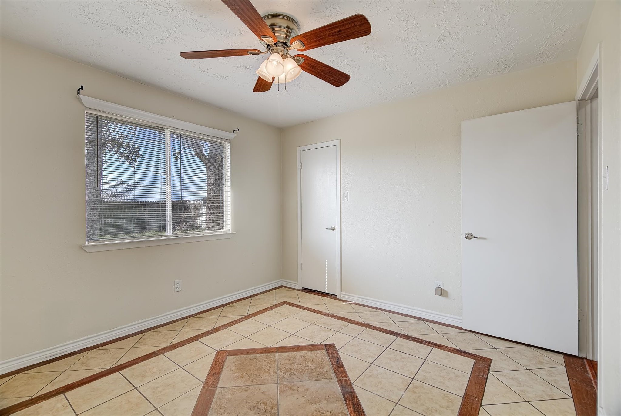 7515 Shoshone Drive Baytown, TX 77521 - Photo 25 of 39 a view of empty room with wooden floor and fan