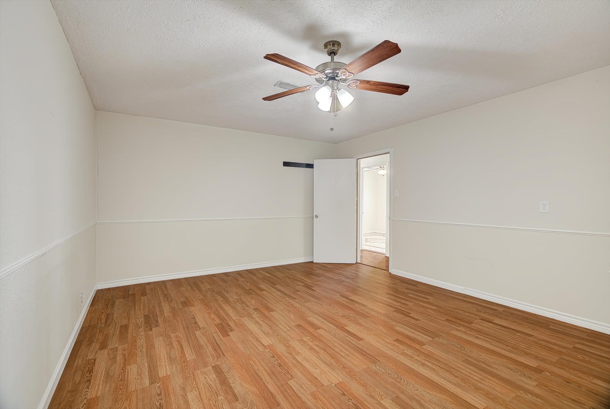 7515 Shoshone Drive Baytown, TX 77521 - Photo 27 of 39 wooden floor in an empty room