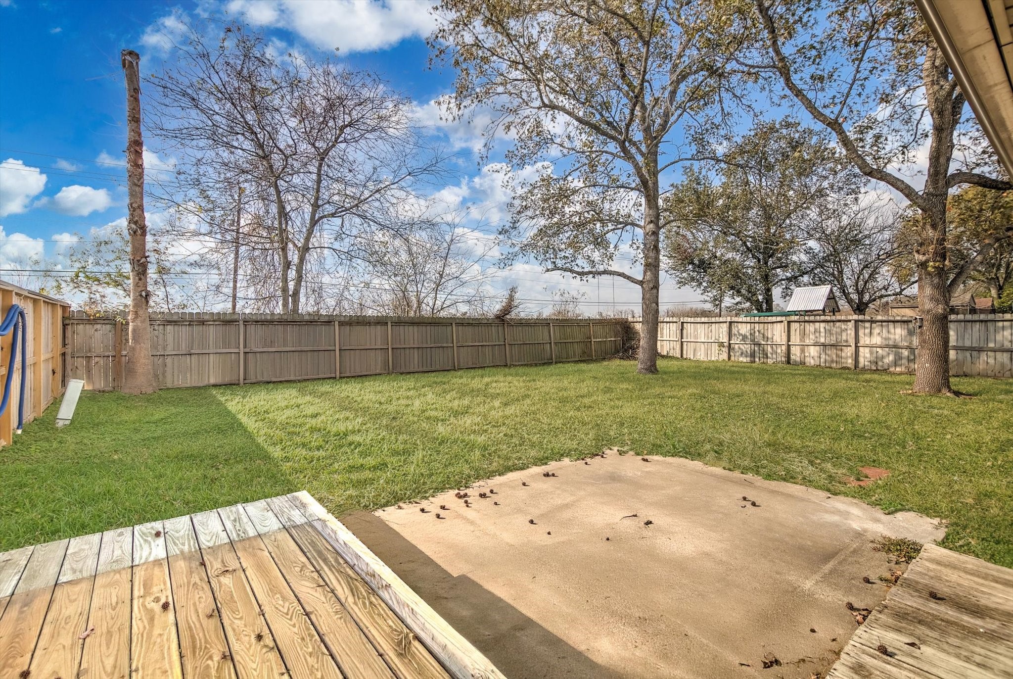 7515 Shoshone Drive Baytown, TX 77521 - Photo 34 of 39 a view of a backyard with wooden floor