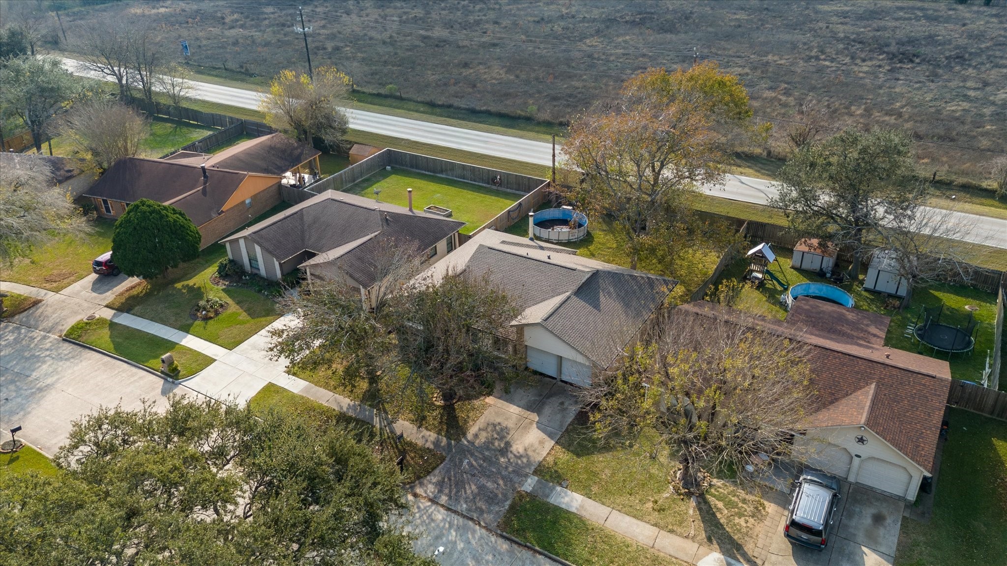 7515 Shoshone Drive Baytown, TX 77521 - Photo 39 of 39 an aerial view of a house with a yard and lake view