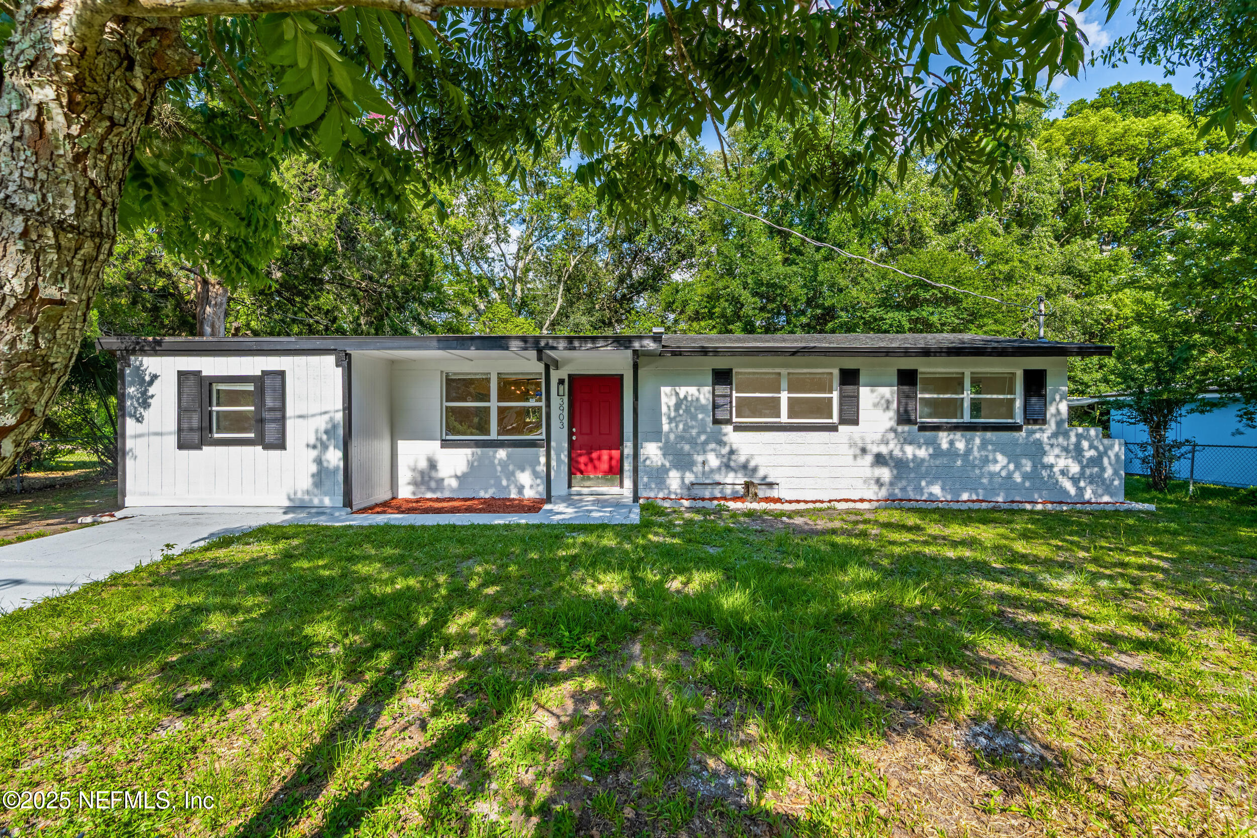 3903 Macgregor Drive Jacksonville, FL 32210 - Photo 1 of 49 front view of a house with a patio