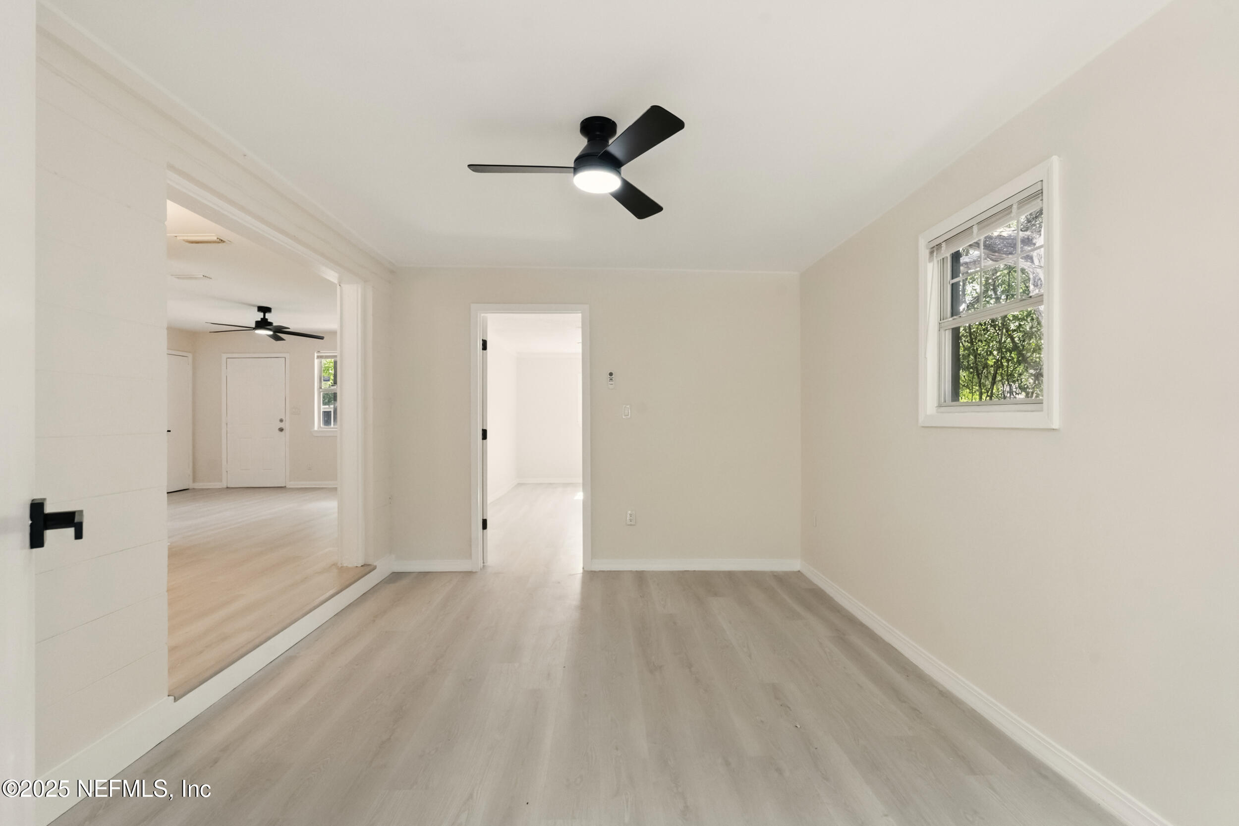 3903 Macgregor Drive Jacksonville, FL 32210 - Photo 23 of 49 a view of empty room with wooden floor and fan