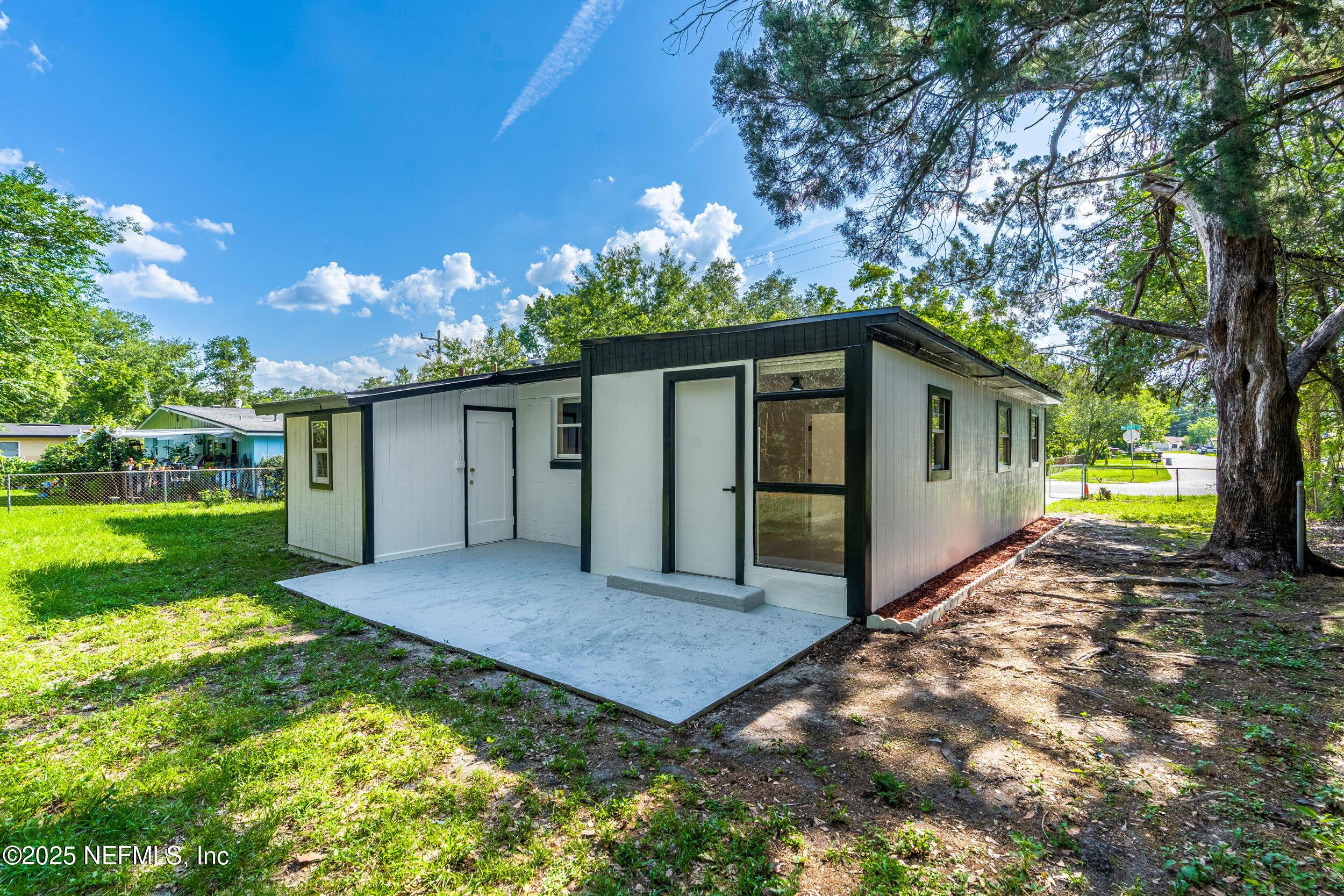 3903 Macgregor Drive Jacksonville, FL 32210 - Photo 33 of 49 a view of a house with backyard and garden