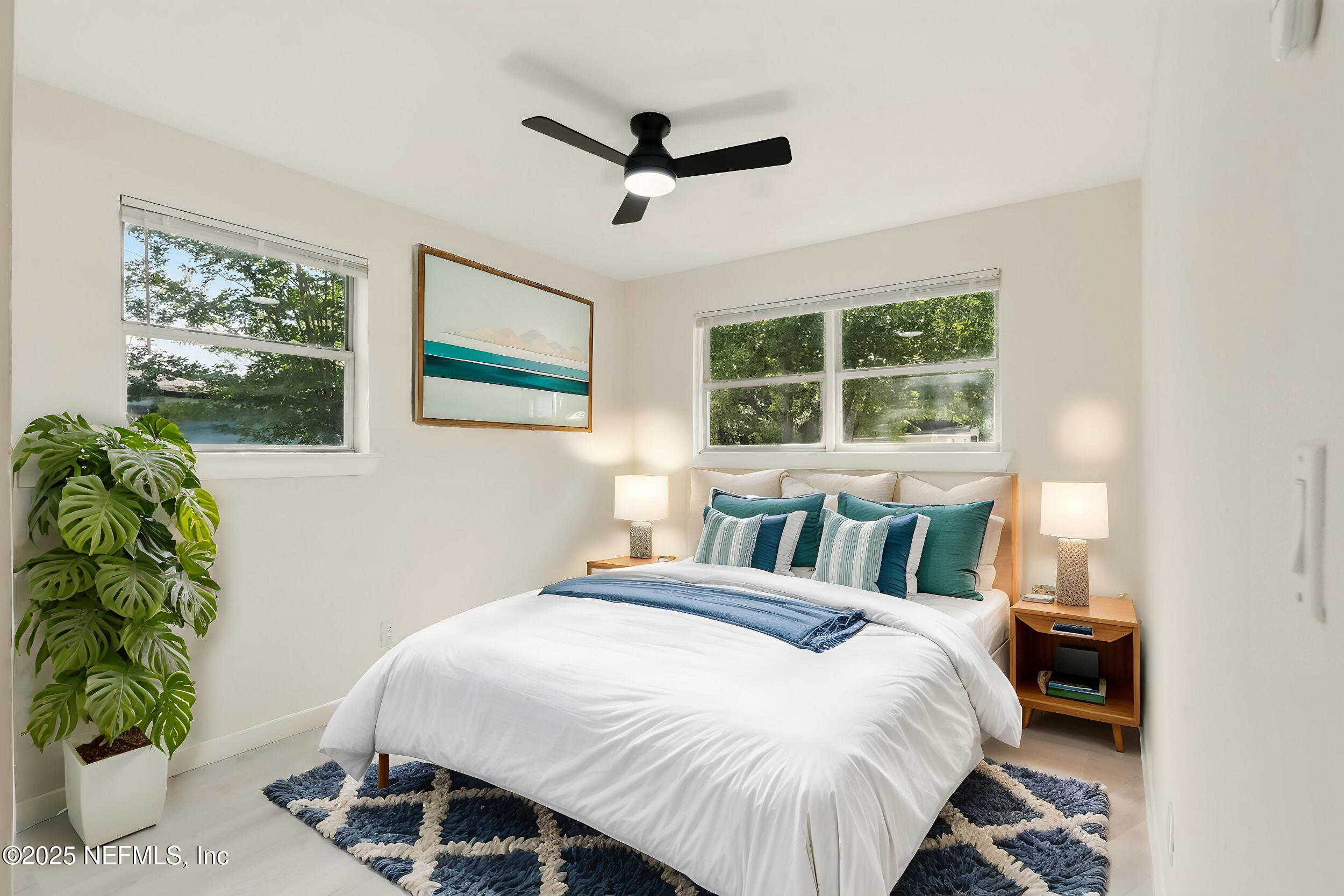 3903 Macgregor Drive Jacksonville, FL 32210 - Photo 5 of 49 a bedroom with a bed mirror and window