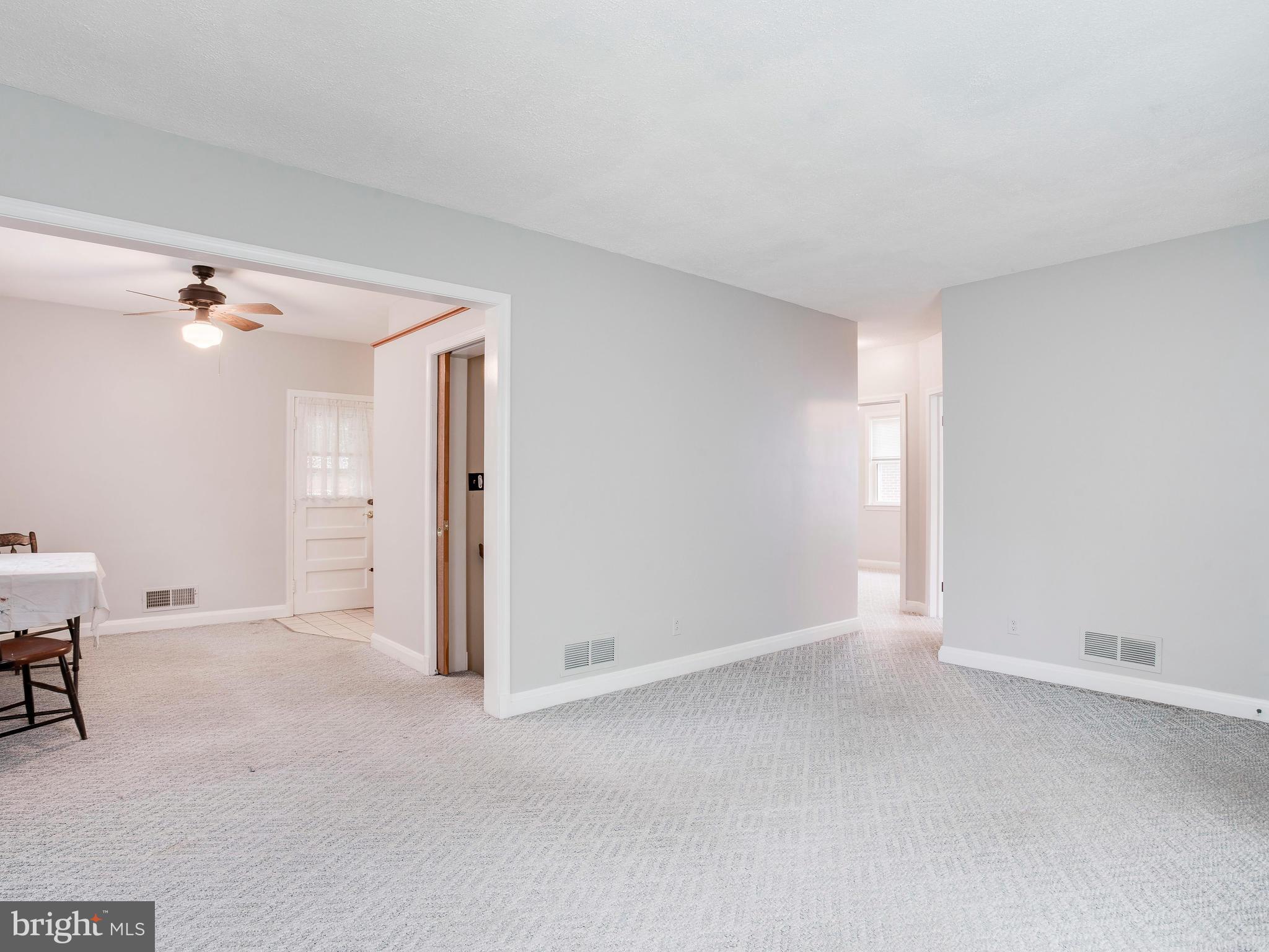 602 Woodside Road Baltimore, MD 21208 - Photo 13 of 30 Living Room looking into dining area