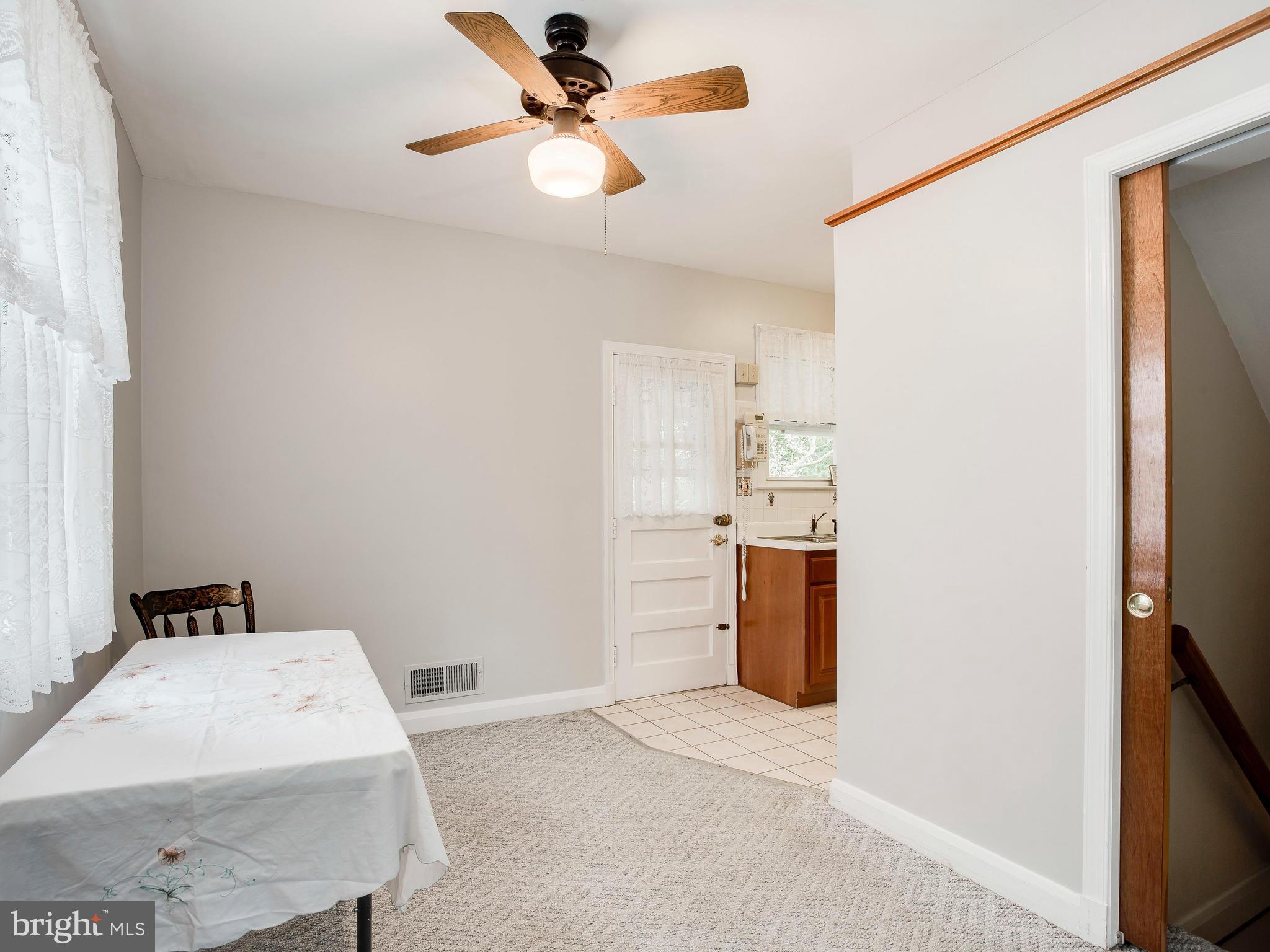 602 Woodside Road Baltimore, MD 21208 - Photo 15 of 30 Dining area, pocket door leads to finished basmt