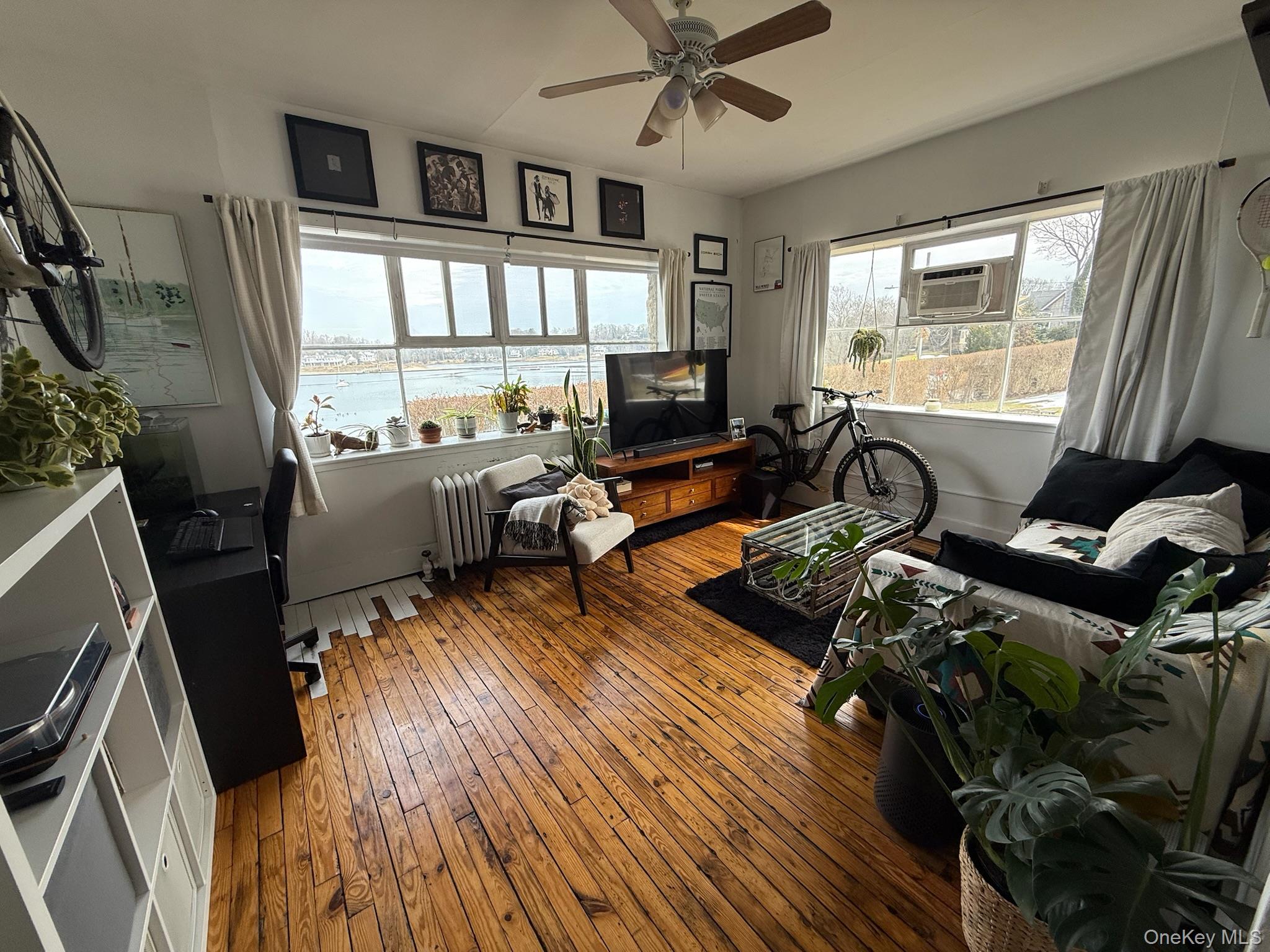 293 West Shore Road, Unit 1 Huntington, NY 11743 - Photo 3 of 13 a living room with furniture window and wooden floor