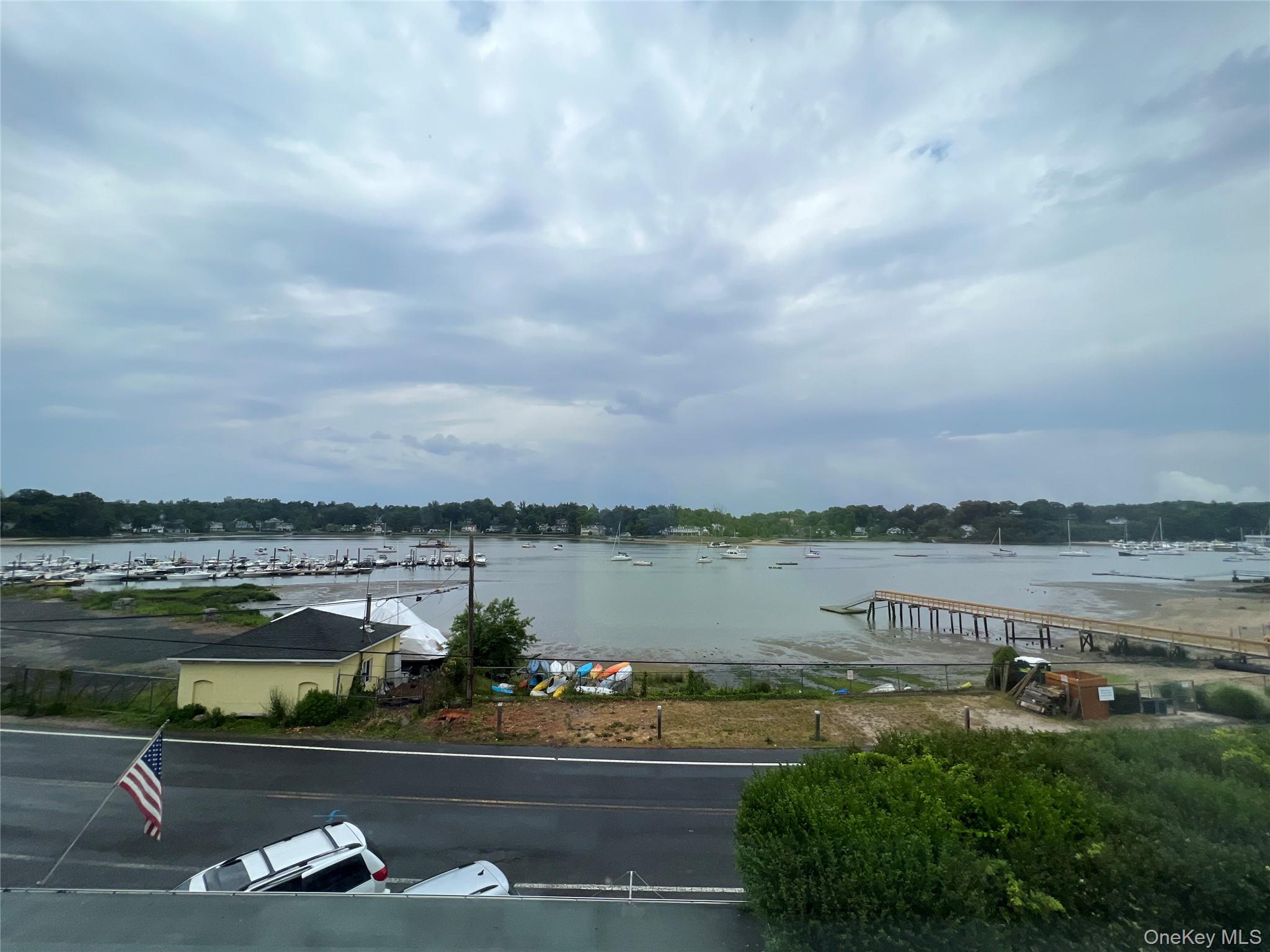 293 West Shore Road, Unit 1 Huntington, NY 11743 - Photo 5 of 13 a view of a lake with houses in the back