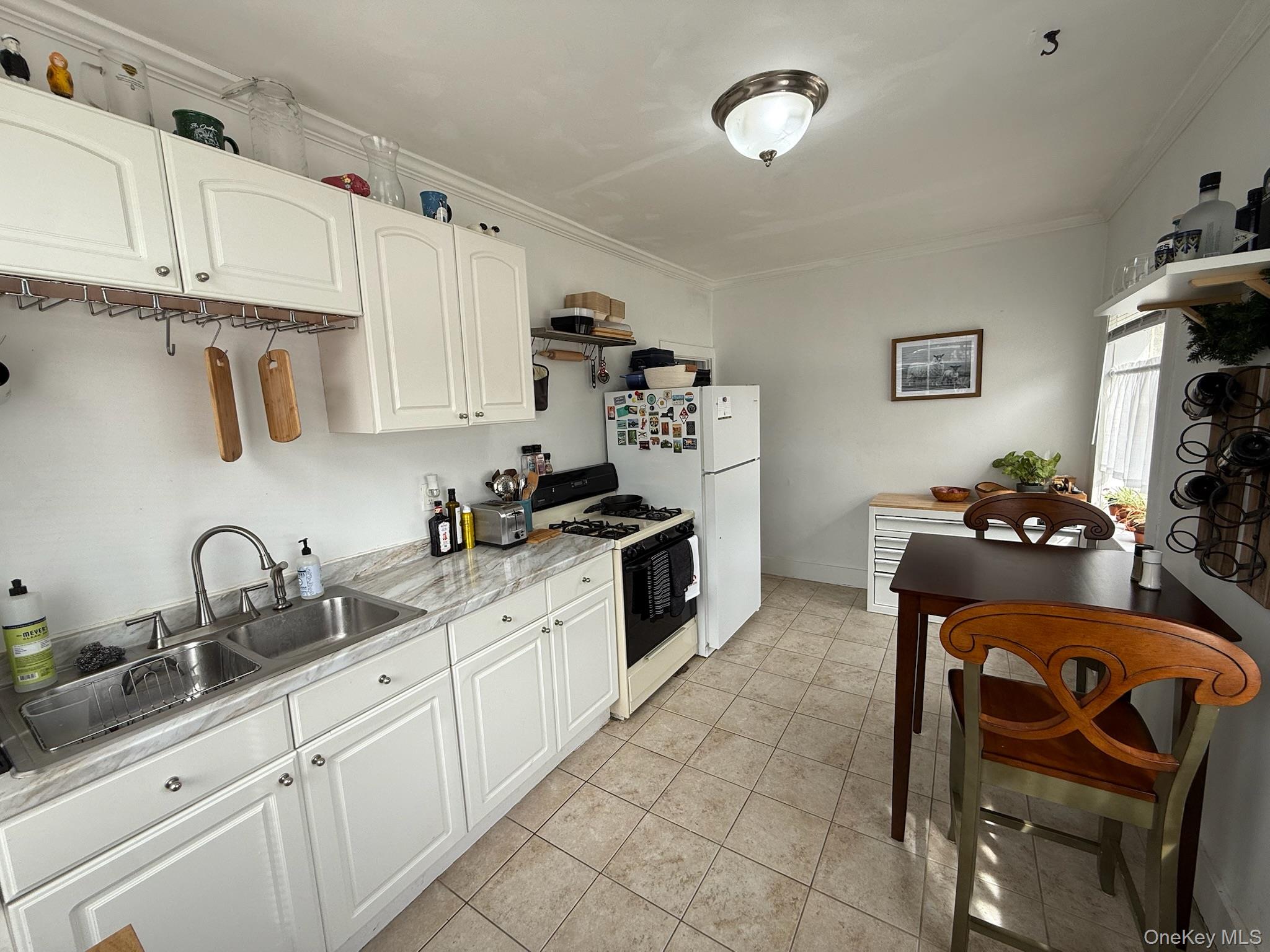 293 West Shore Road, Unit 1 Huntington, NY 11743 - Photo 8 of 13 a kitchen with granite countertop a sink cabinets and appliances