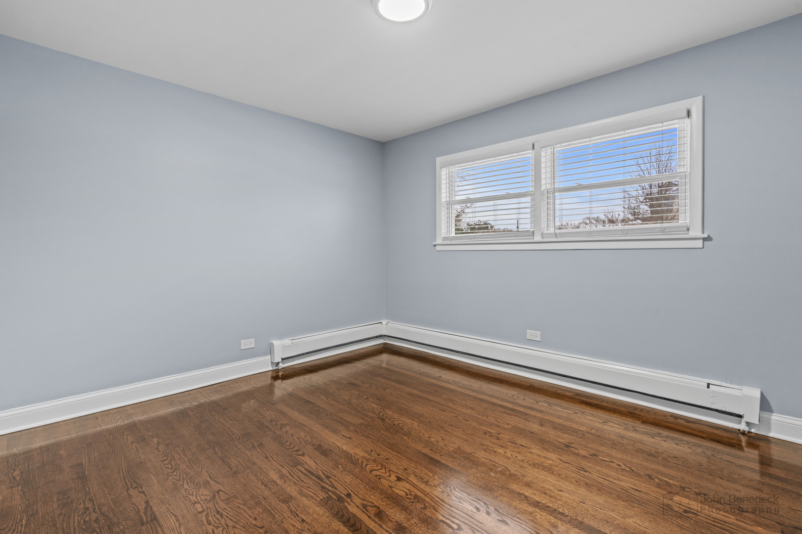 2170 Douglas Avenue Des Plaines, IL 60018 - Photo 12 of 21 an empty room with wooden floor and windows