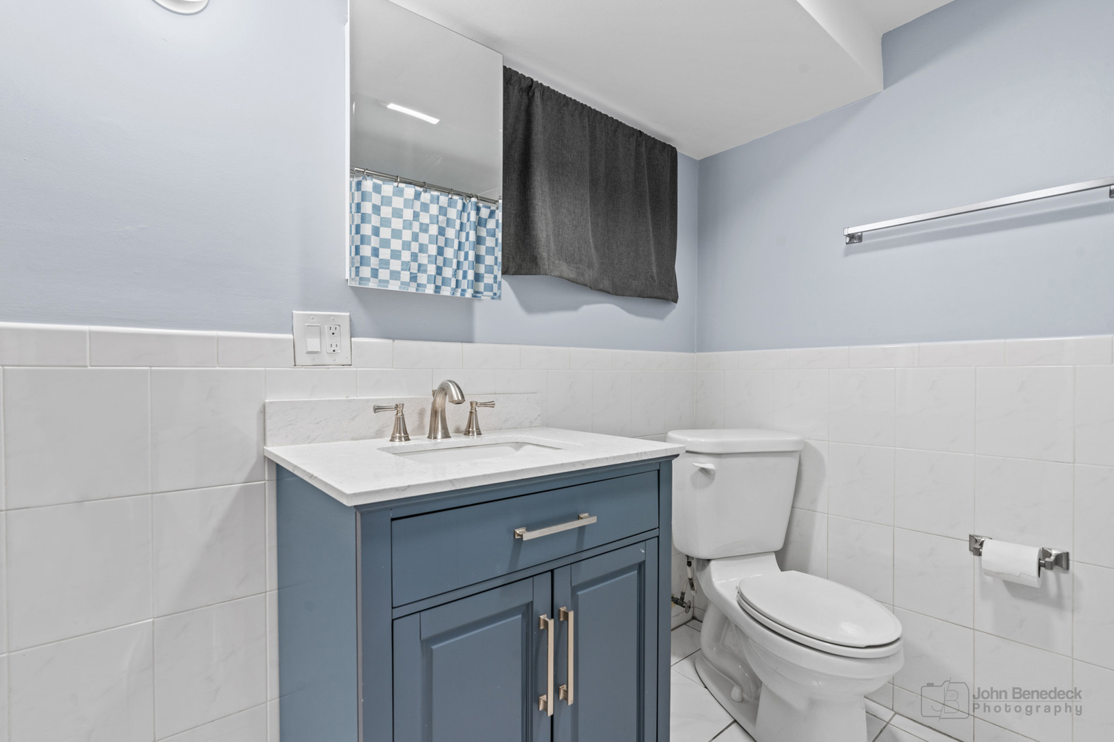 2170 Douglas Avenue Des Plaines, IL 60018 - Photo 17 of 21 a bathroom with a toilet a sink and mirror