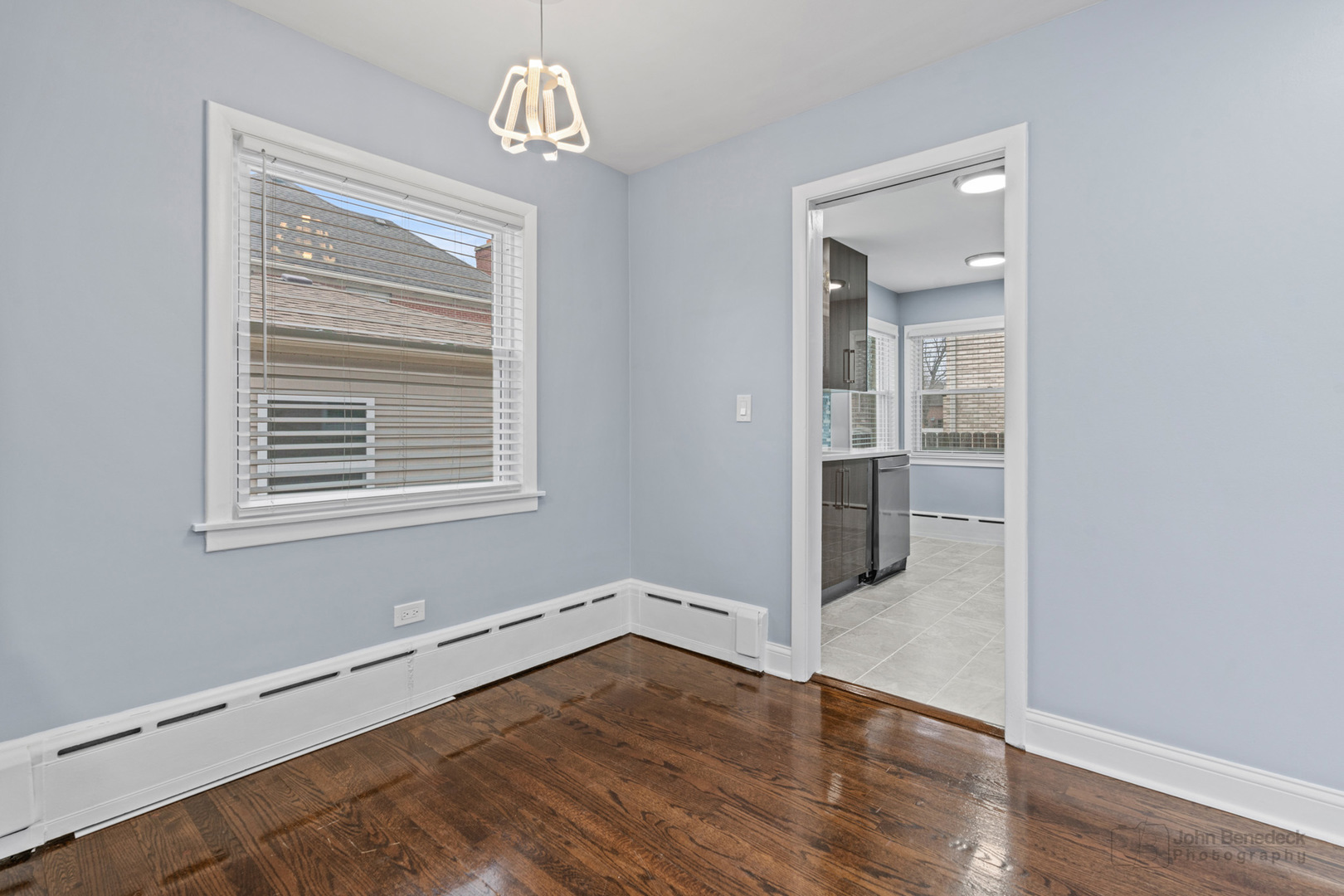 2170 Douglas Avenue Des Plaines, IL 60018 - Photo 7 of 21 wooden floor in an empty room with a window