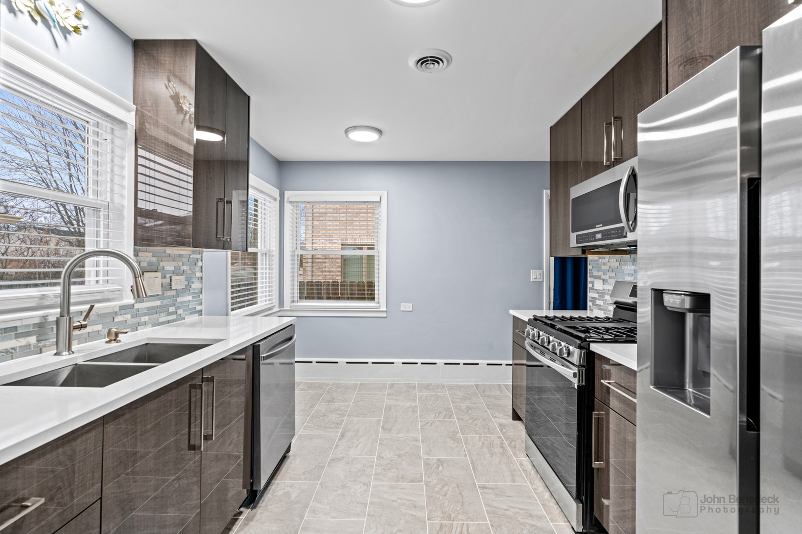 2170 Douglas Avenue Des Plaines, IL 60018 - Photo 8 of 21 a kitchen with stainless steel appliances granite countertop a sink stove and refrigerator