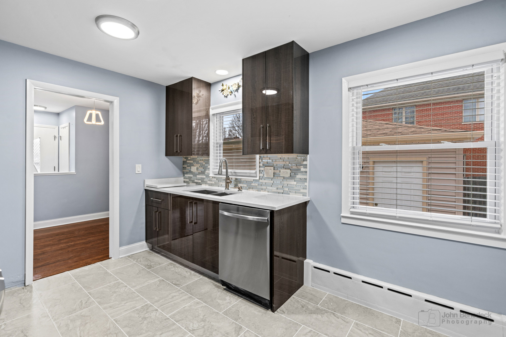 2170 Douglas Avenue Des Plaines, IL 60018 - Photo 10 of 21 a bathroom with a sink double vanity and a mirror