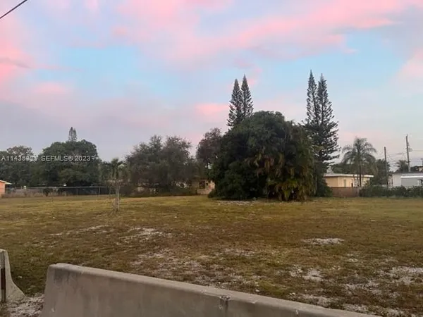 a view of a lake with a big yard