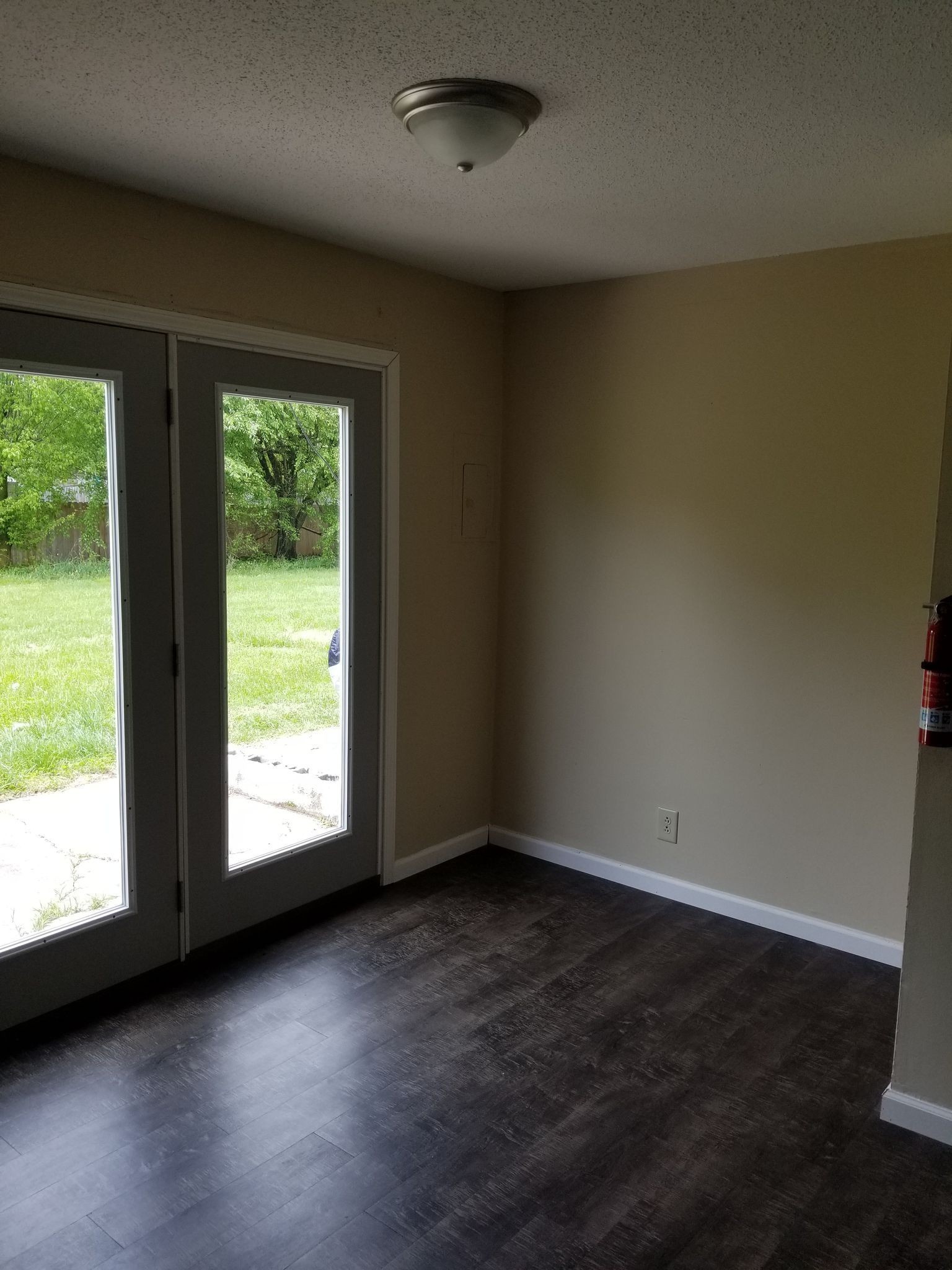 1251 State Line Road Oak Grove, KY 42262 - Photo 3 of 6 an empty room with wooden floor and windows
