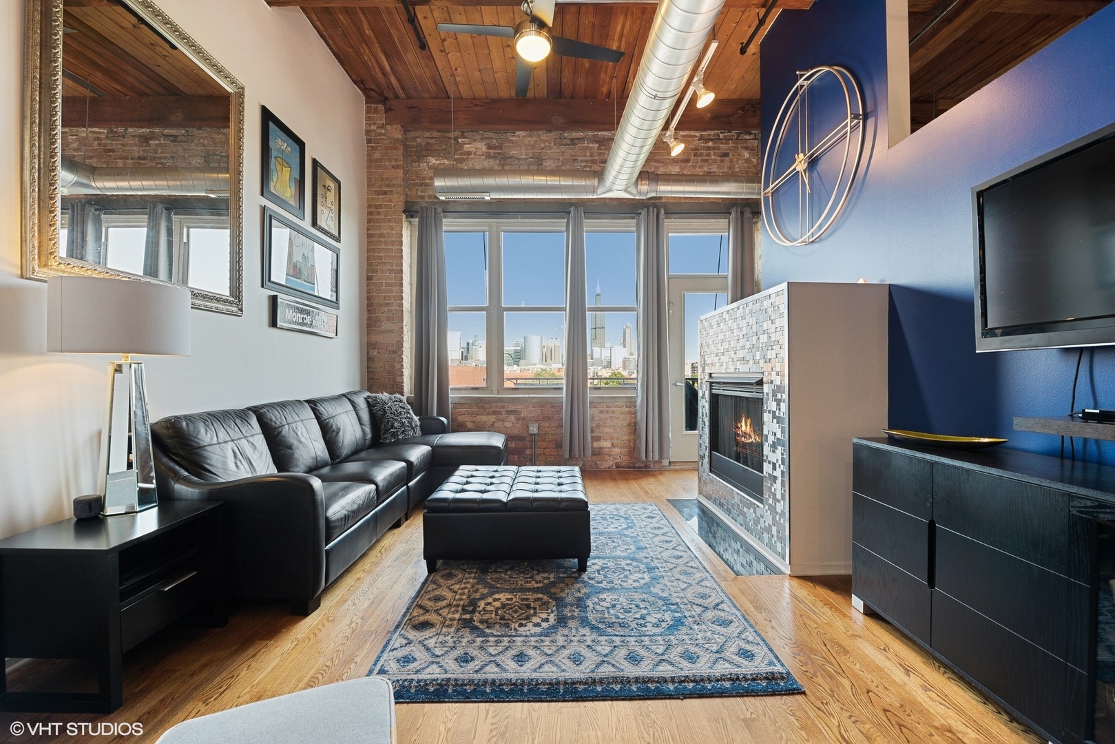 1500 West Monroe Street, Unit 623 Chicago, IL 60607 - Photo 2 of 11 a living room with furniture rug and a fireplace
