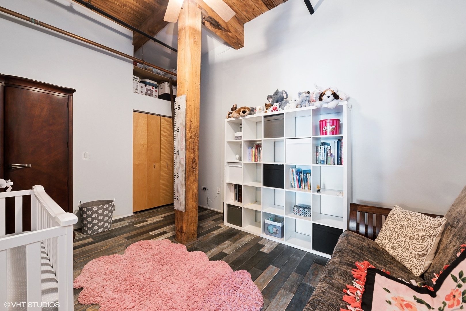1500 West Monroe Street, Unit 623 Chicago, IL 60607 - Photo 9 of 11 a bedroom with furniture and a book shelf