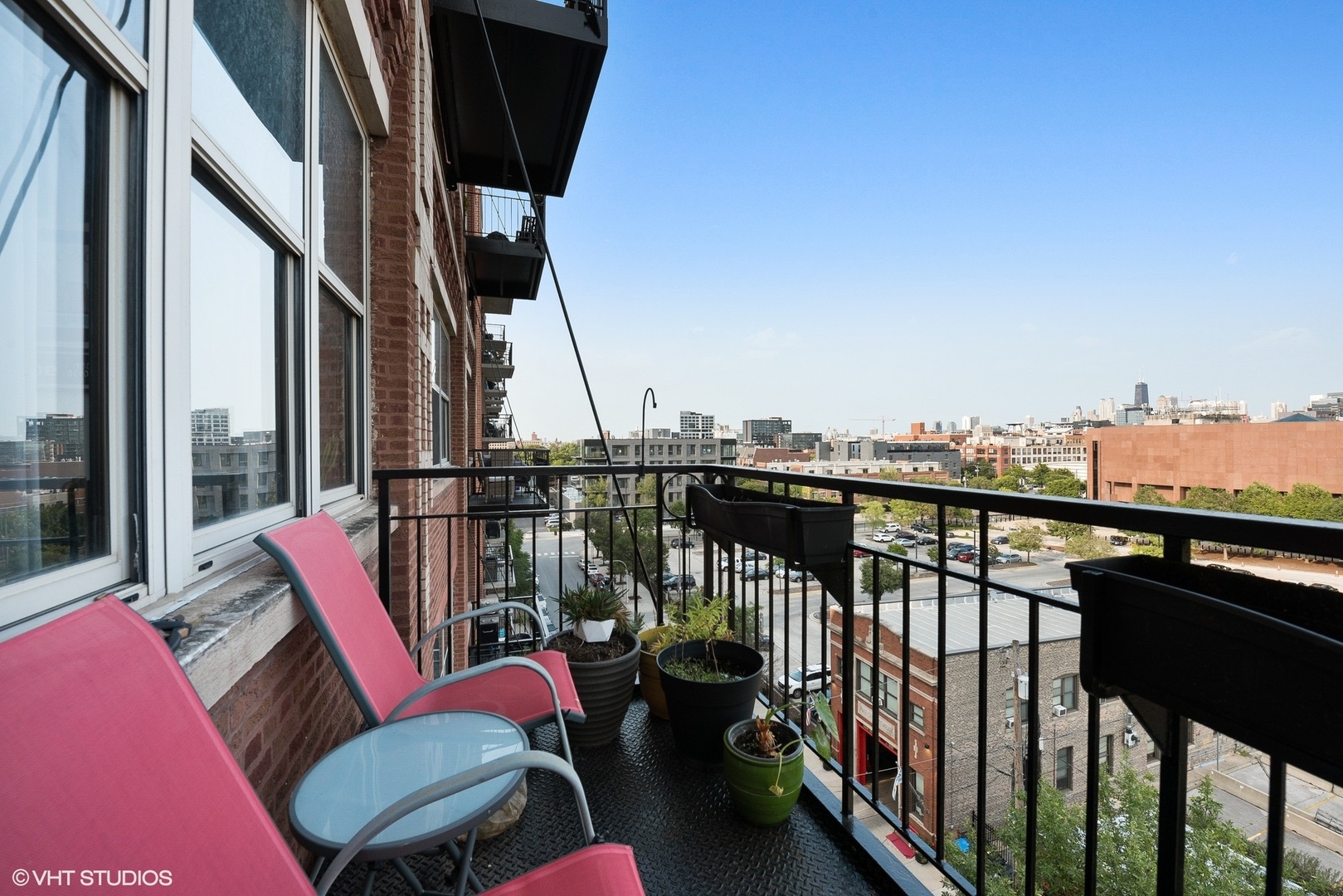1500 West Monroe Street, Unit 623 Chicago, IL 60607 - Photo 10 of 11 a view of a balcony with furniture