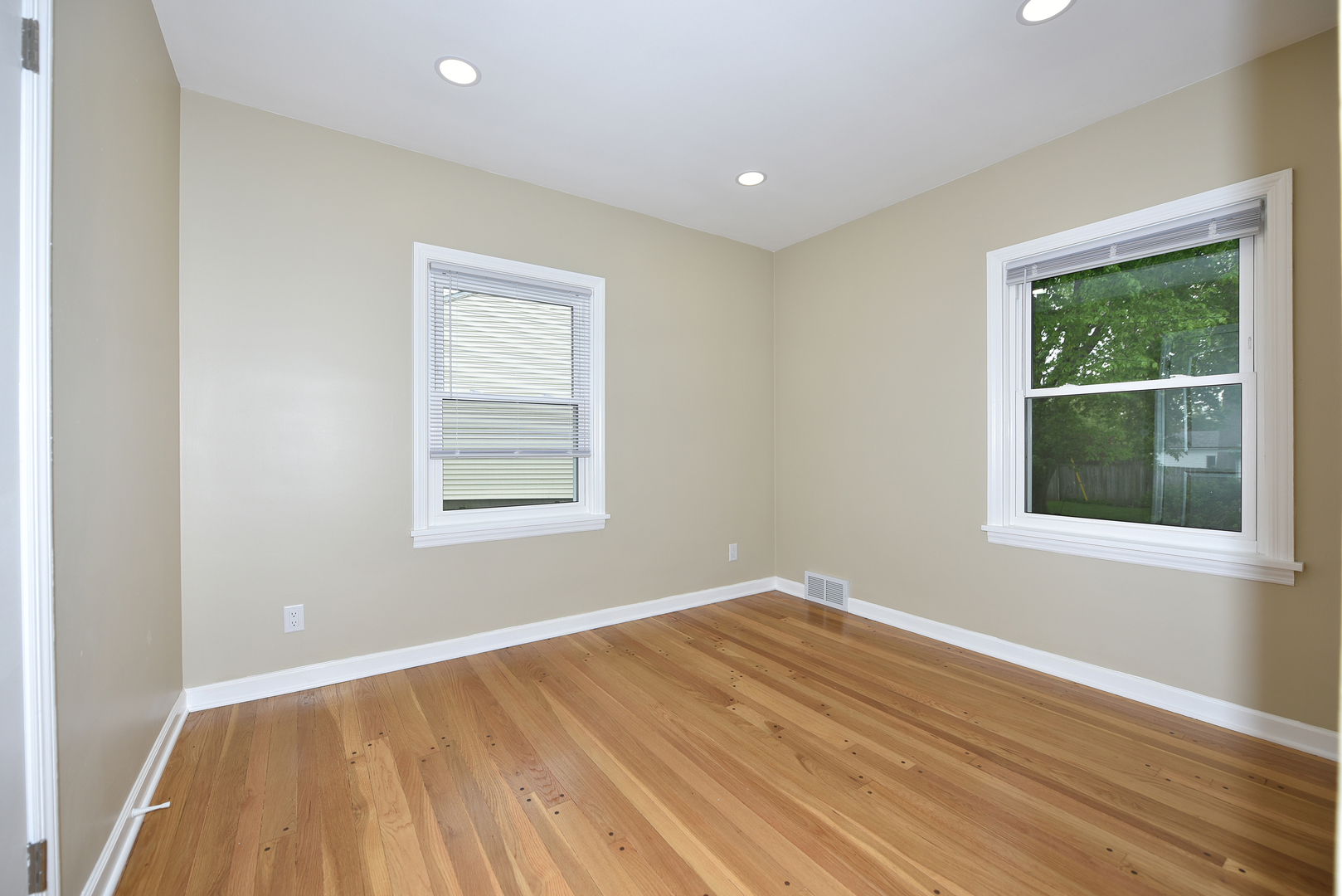 502 Manchester Road Normal, IL 61761 - Photo 12 of 29 a view of a room with wooden floor and windows