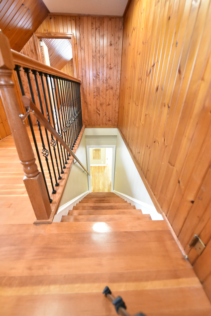 502 Manchester Road Normal, IL 61761 - Photo 19 of 29 a view of staircase with large window