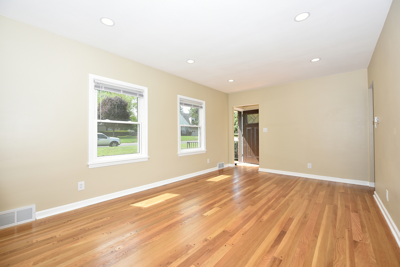 502 Manchester Road Normal, IL 61761 - Photo 3 of 29 an empty room with wooden floor and windows