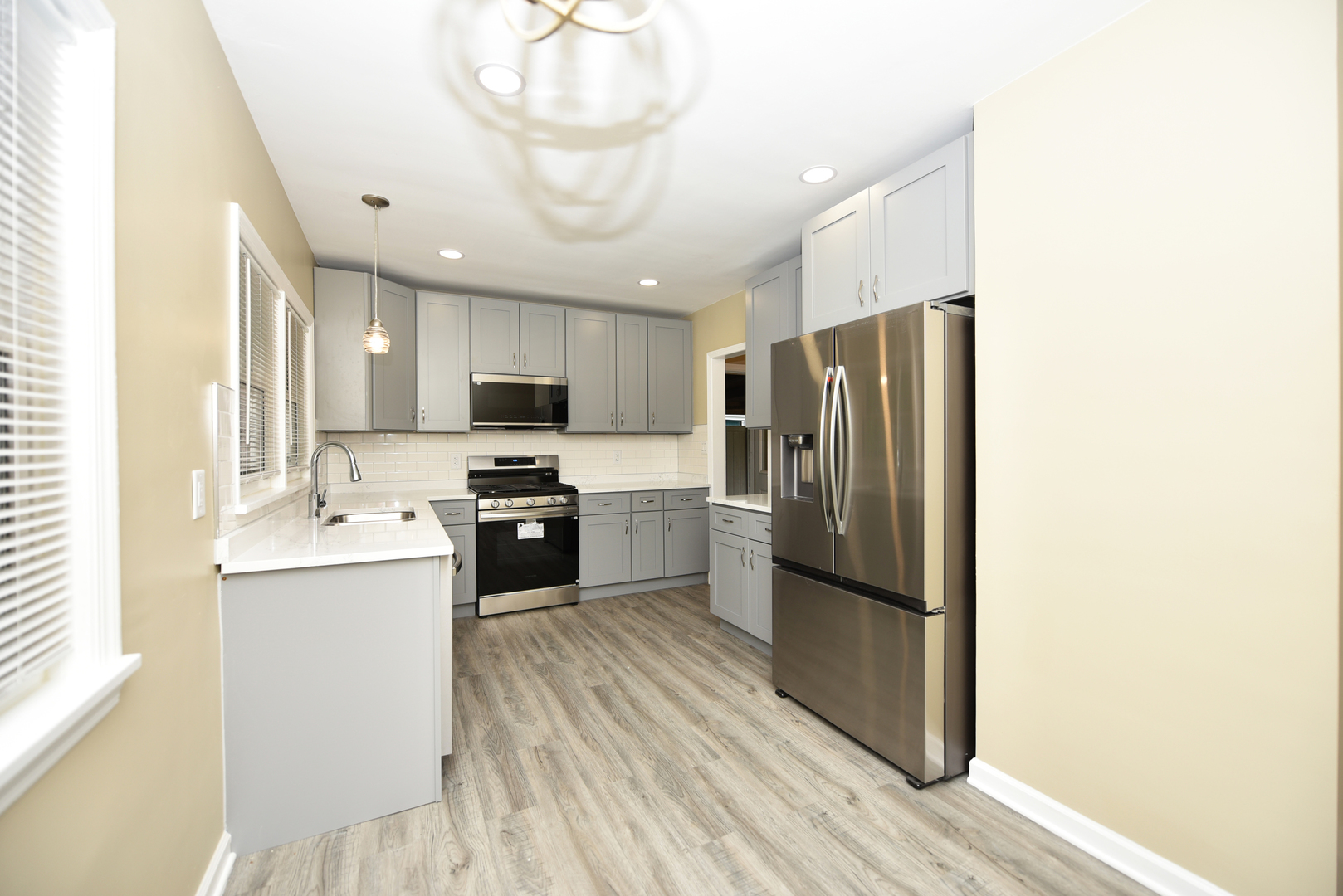 502 Manchester Road Normal, IL 61761 - Photo 7 of 29 a kitchen with stainless steel appliances a refrigerator sink and microwave