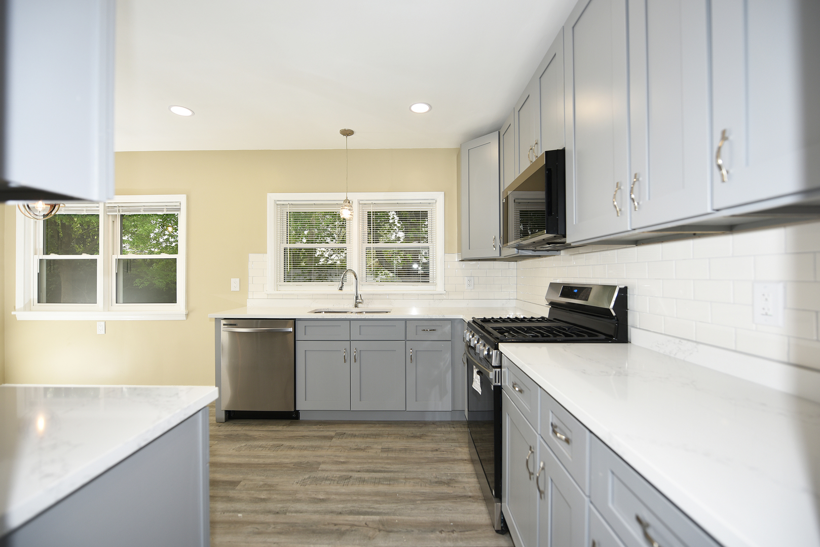 502 Manchester Road Normal, IL 61761 - Photo 9 of 29 a kitchen with a sink stove top oven and cabinets