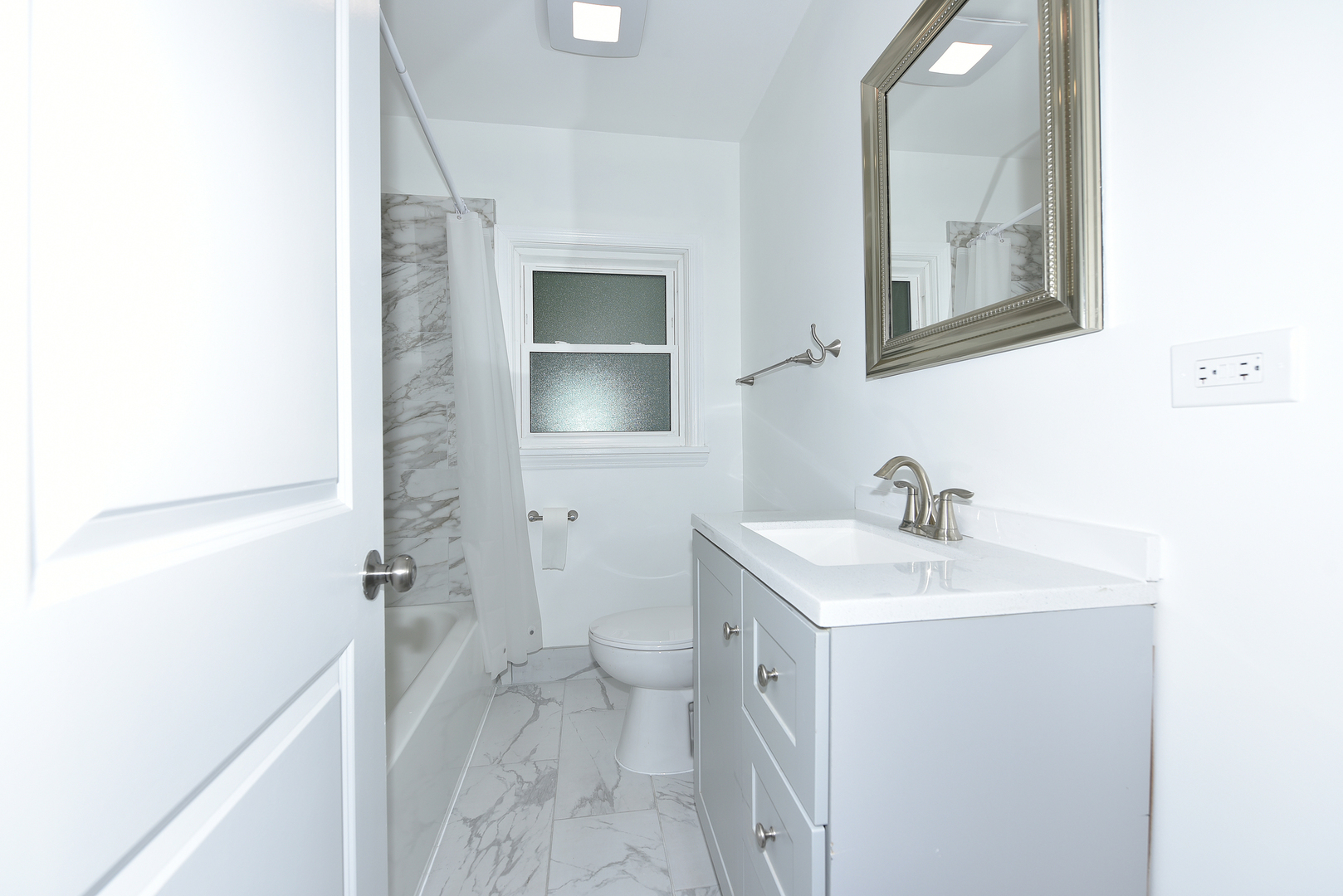 502 Manchester Road Normal, IL 61761 - Photo 10 of 29 a bathroom with a sink toilet and mirror