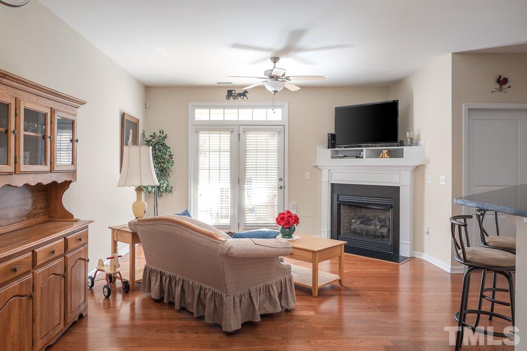 1345 Still Monument Way Raleigh, NC 27603 - Photo 12 of 28 a living room with furniture fireplace and flat screen tv