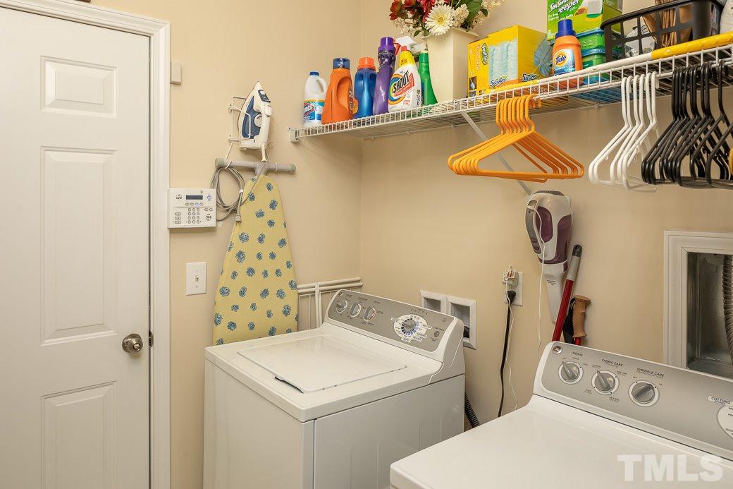 1345 Still Monument Way Raleigh, NC 27603 - Photo 13 of 28 a bathroom with a sink a toilet and shower