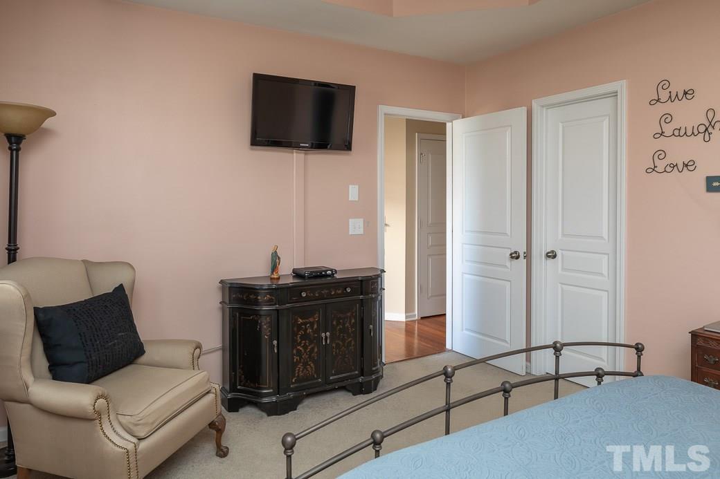 1345 Still Monument Way Raleigh, NC 27603 - Photo 15 of 28 a living room with furniture and a flat screen tv